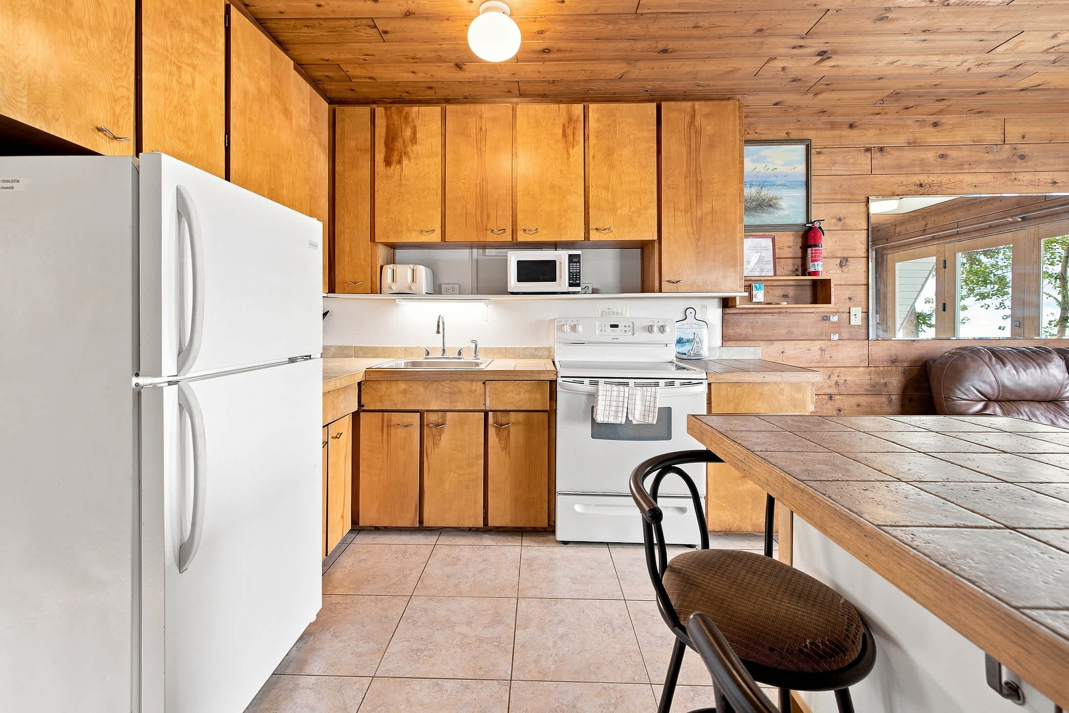 Main-level kitchen with full-size appliances for easy meals at the chalet.