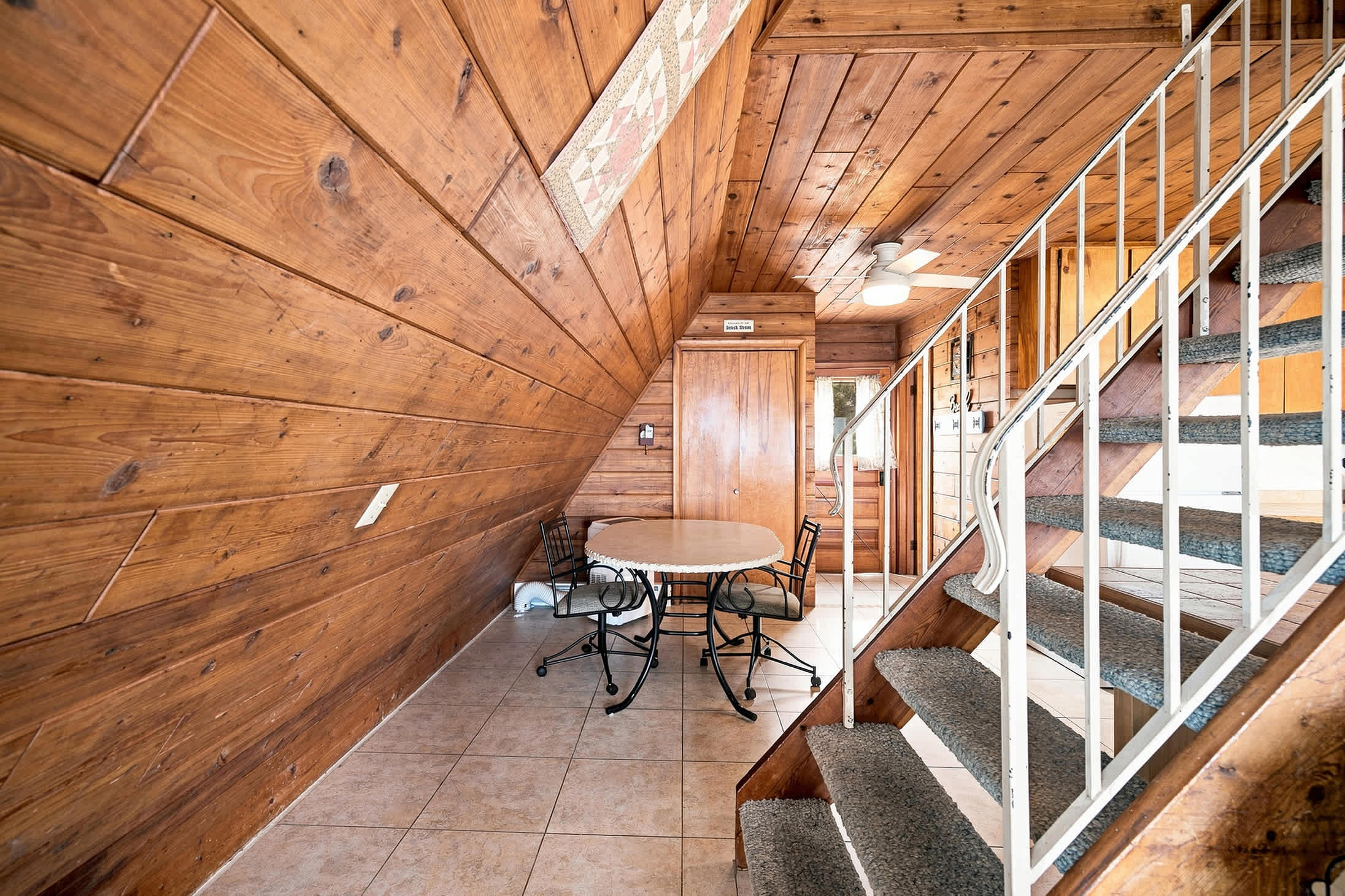 Dining nook beside the kitchen offers a dedicated spot for meals and games.