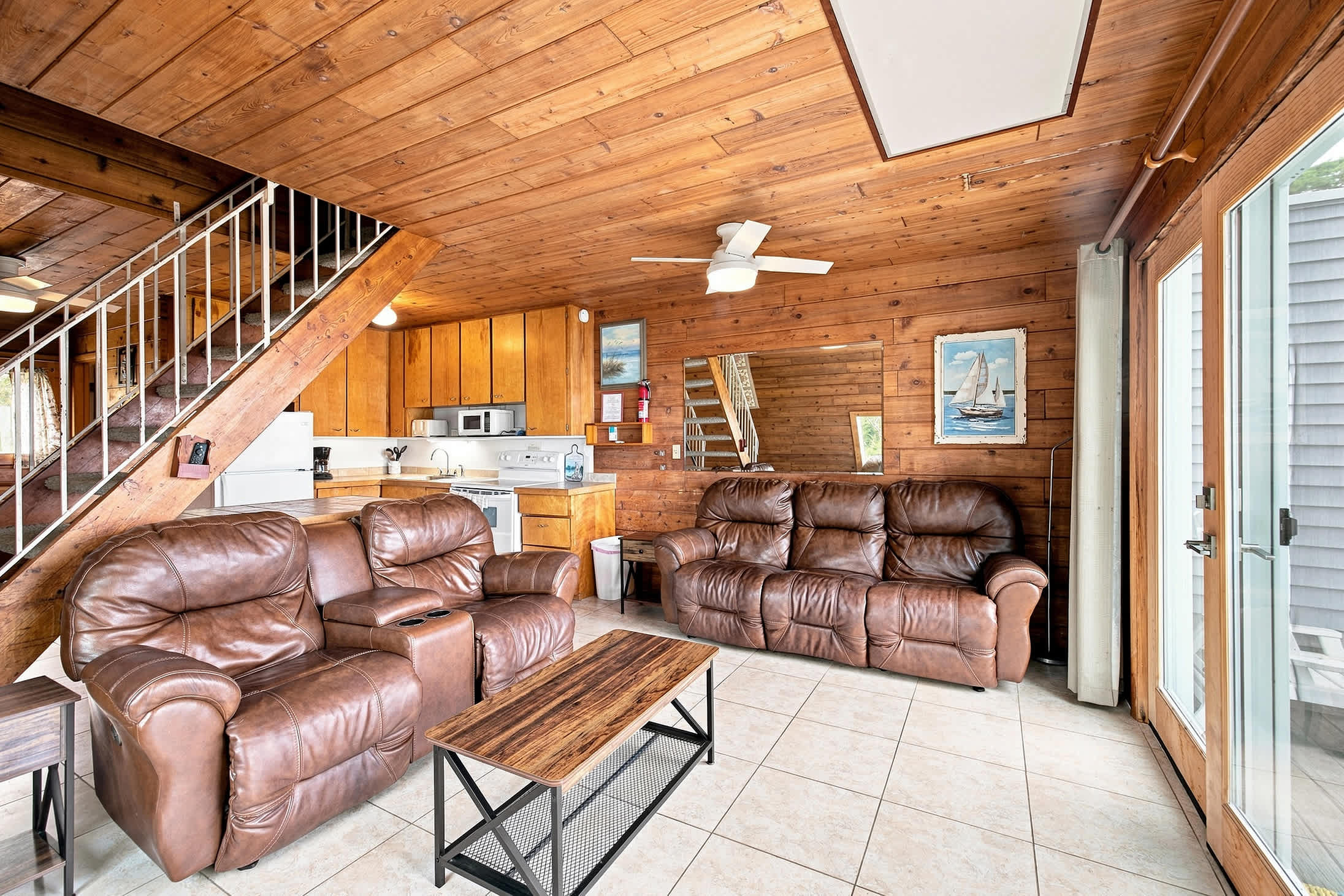 Living room with ample seating and direct access to the Lake Michigan deck.
