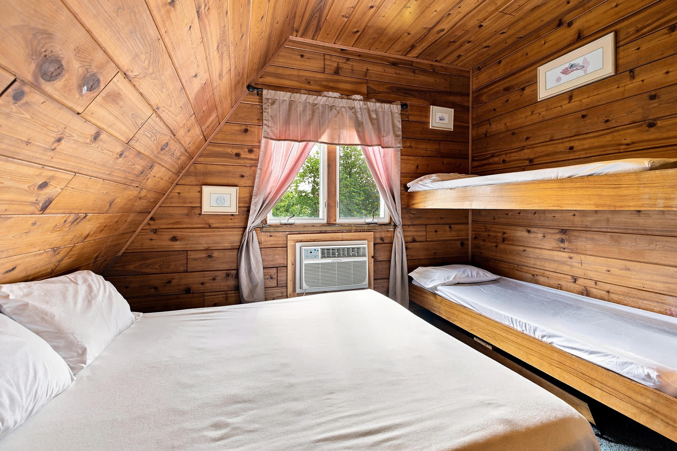 Bedroom 2 is on the upper level and has a queen size and a single bunk bed.