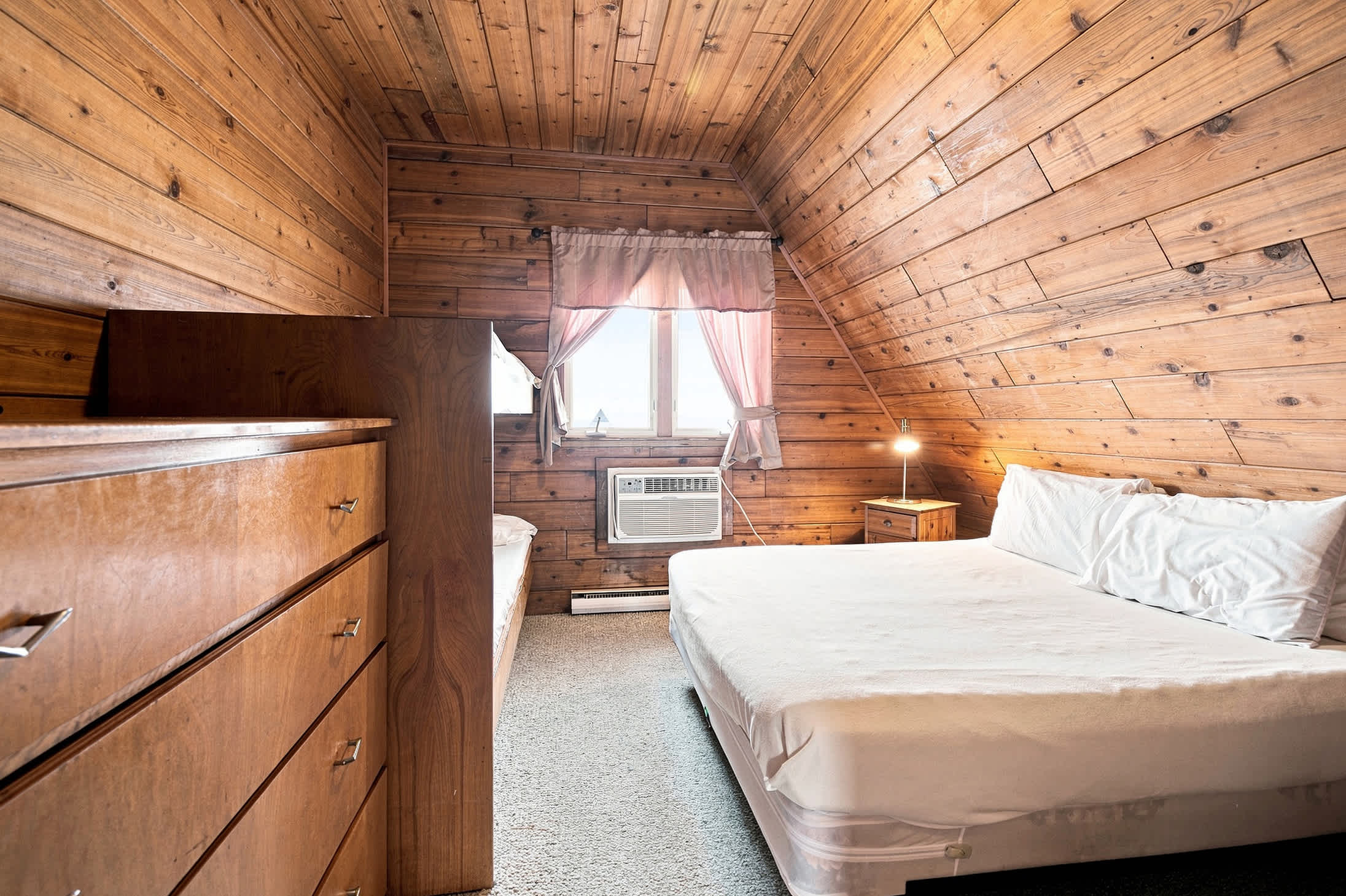 Bedroom 1 is on the upper level and has a queen size and a single bunk bed.