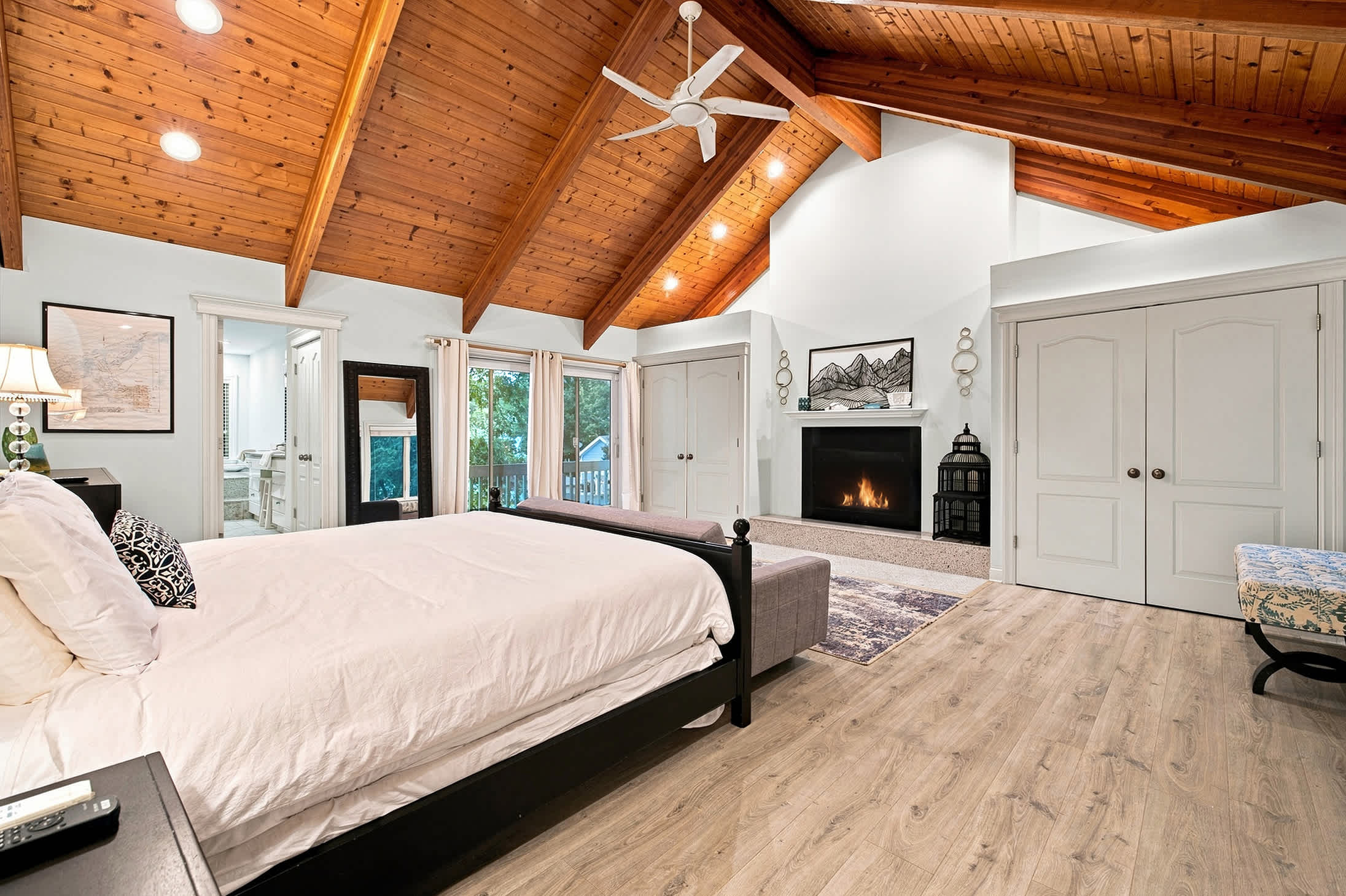 Wake slowly with soft morning light in the signature suite (fireplace not available for guest use).