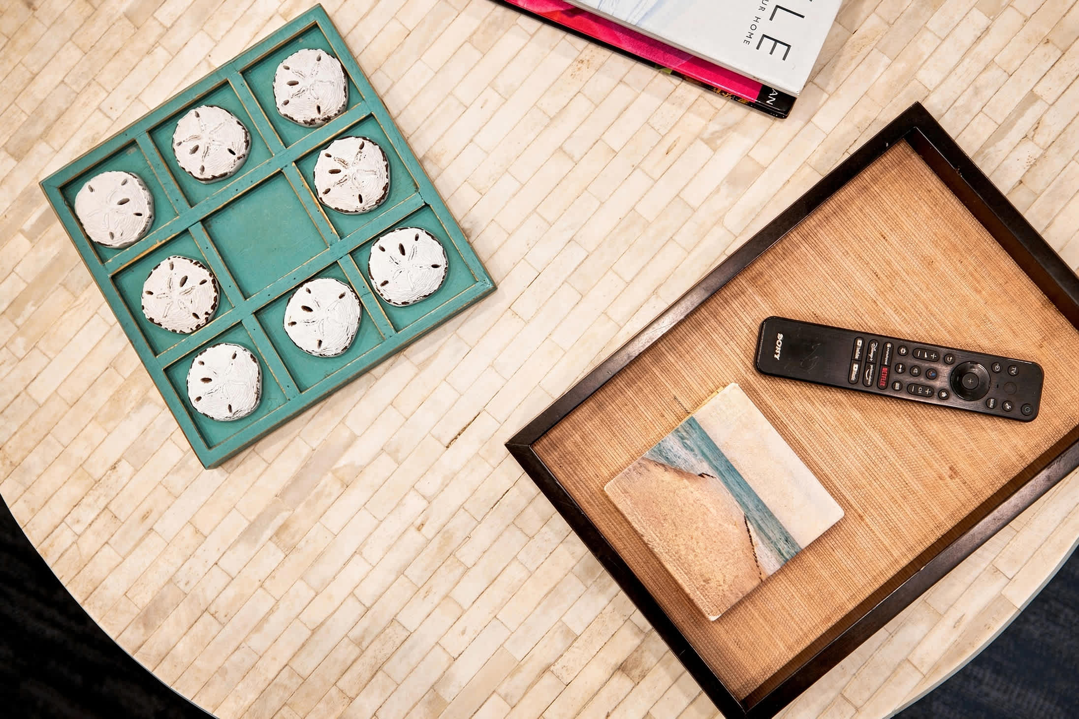 Tic-tac-toe and reading material offer easy entertainment between outings.
