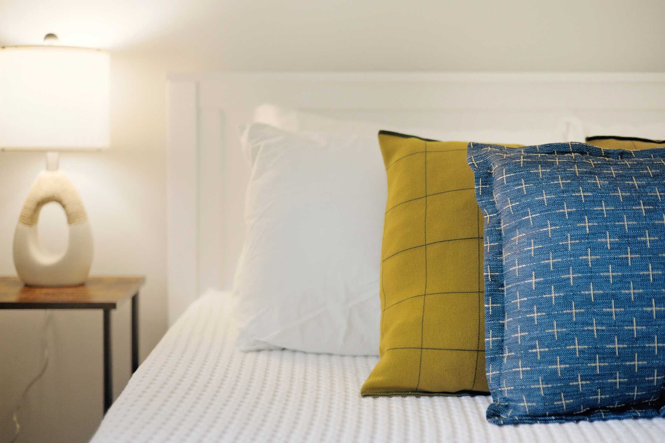 Thoughtful bedroom details add a polished touch to the sleeping space.