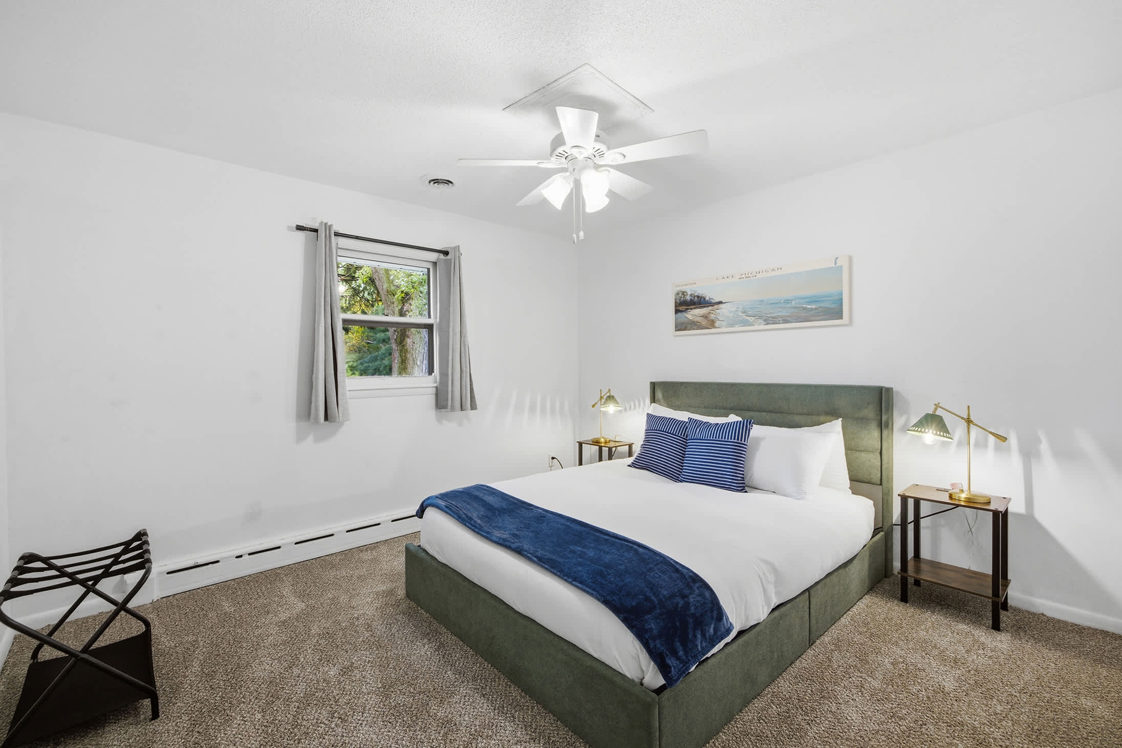 Bedroom 2 is located on the upper level with queen-sized bed.