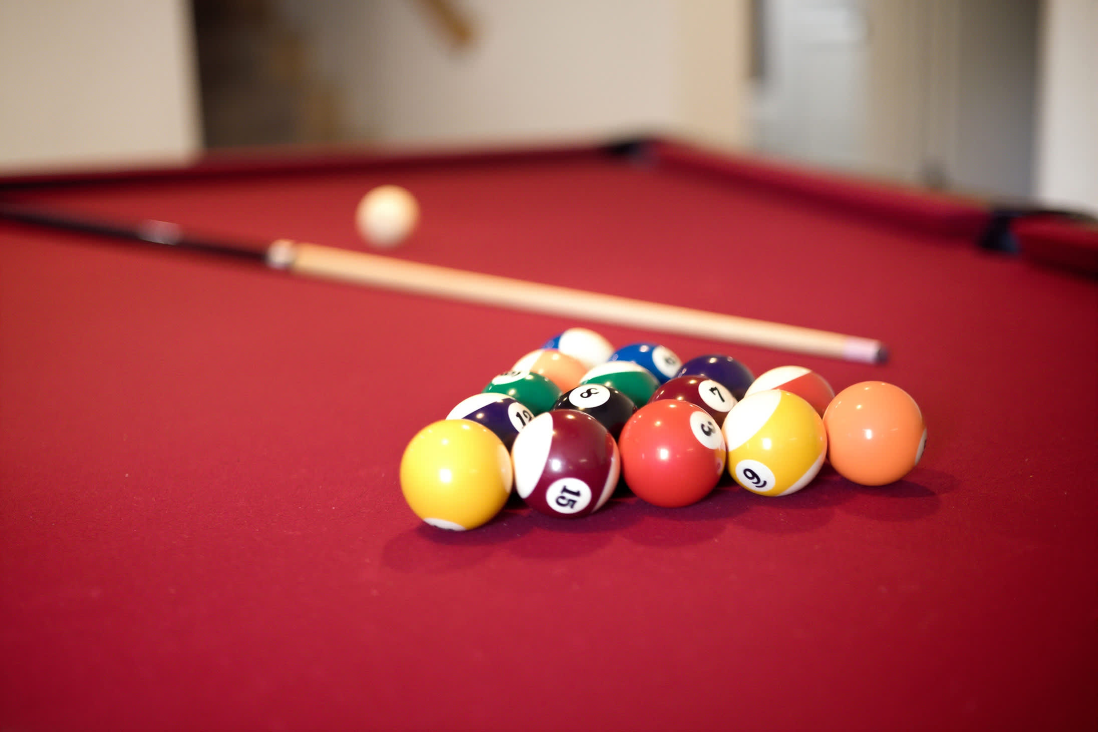 Full-size pool table adds an easy indoor activity for the whole group.