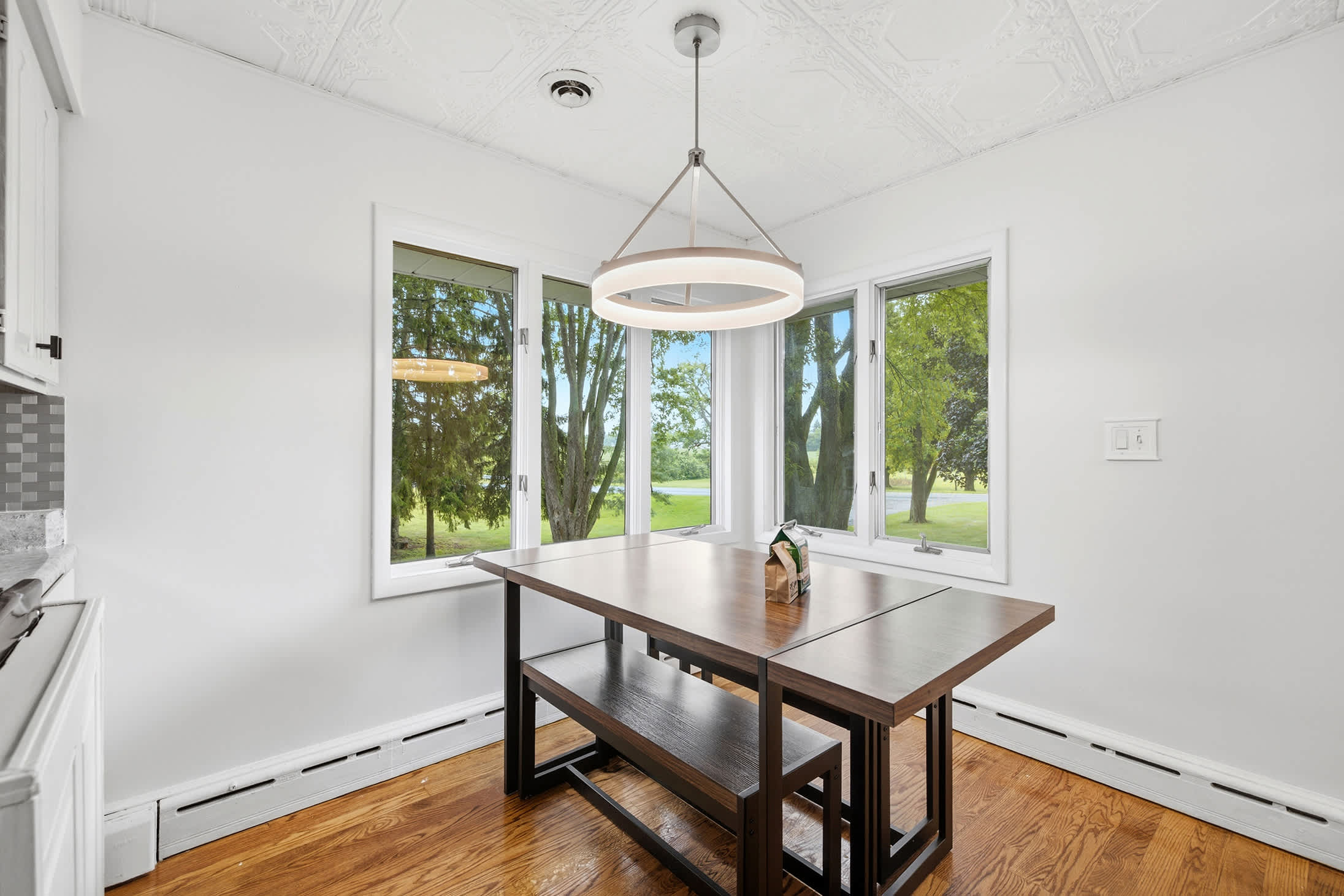 Breakfast nook with park views for relaxed morning meals.