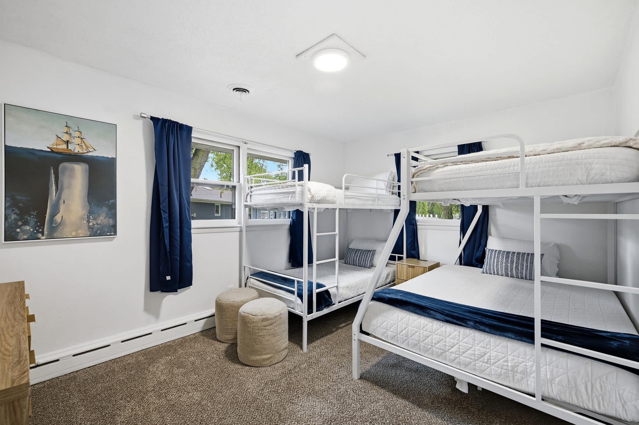 Bedroom 4 is located on the upper level with single over double bunk bed and single bunk bed.