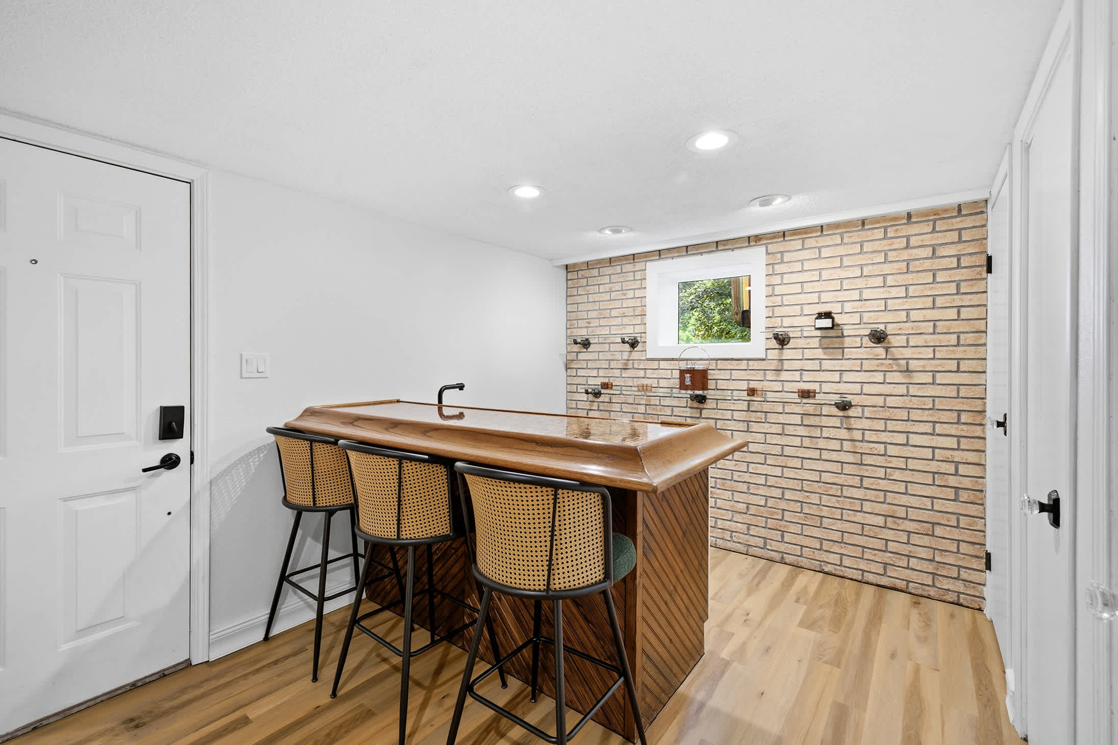 Wet bar near the rec room keeps refreshments within easy reach.