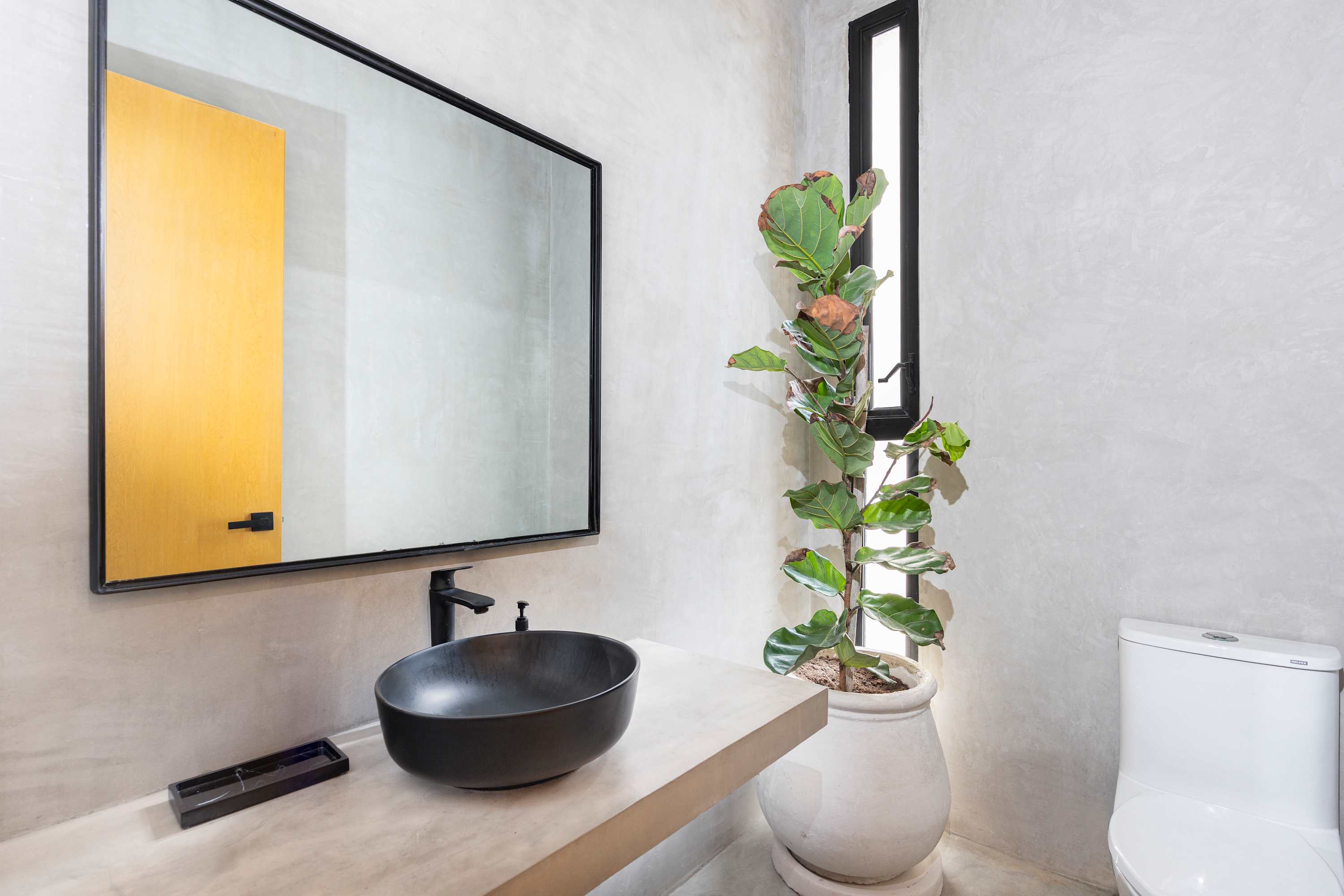 Convenient half bathroom located at the villa entrance. 