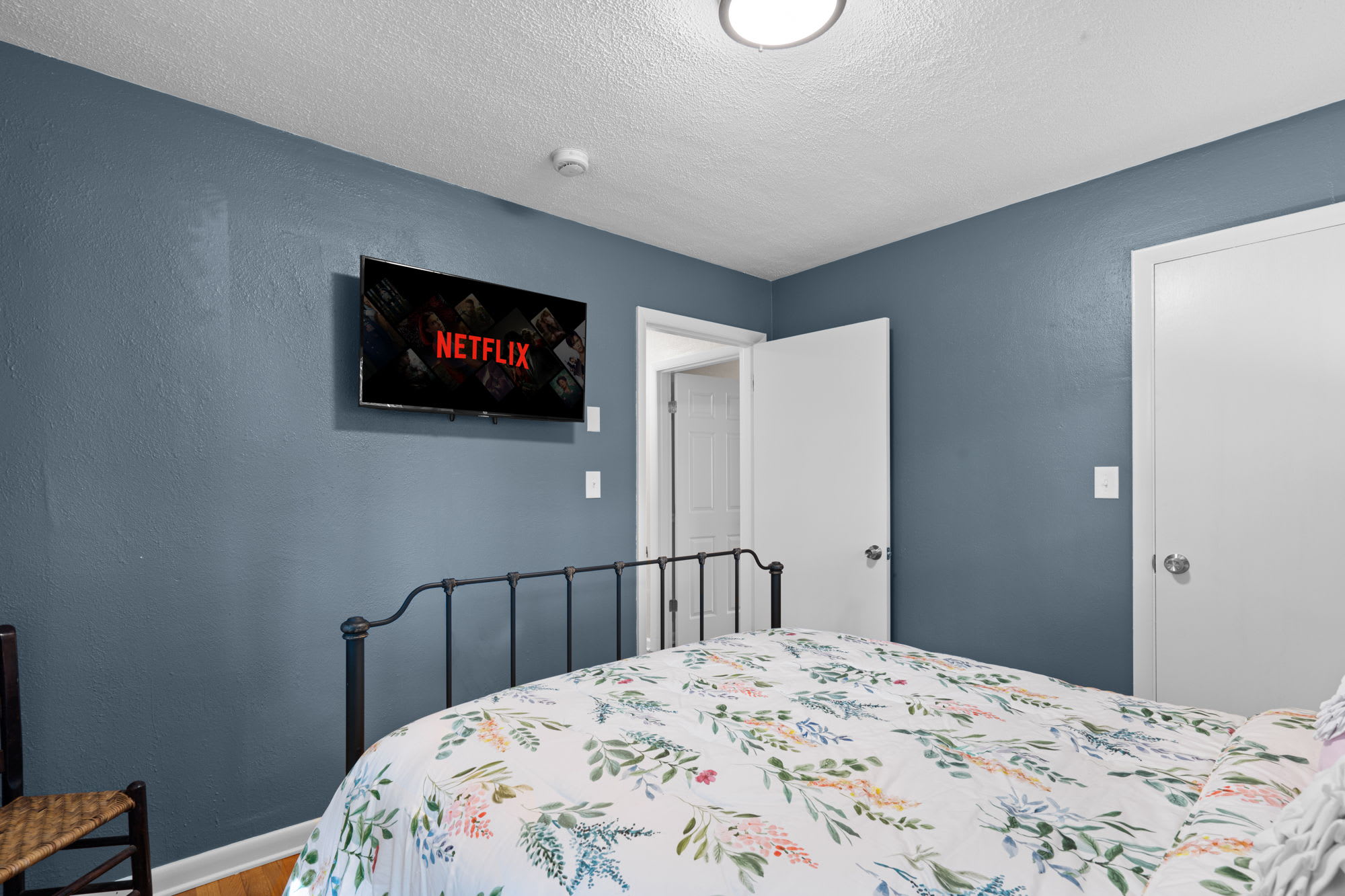 Second bedroom with a smart TV