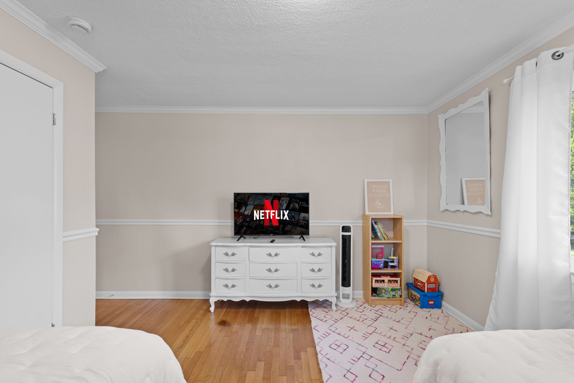 Fourth bedroom with a smart TV