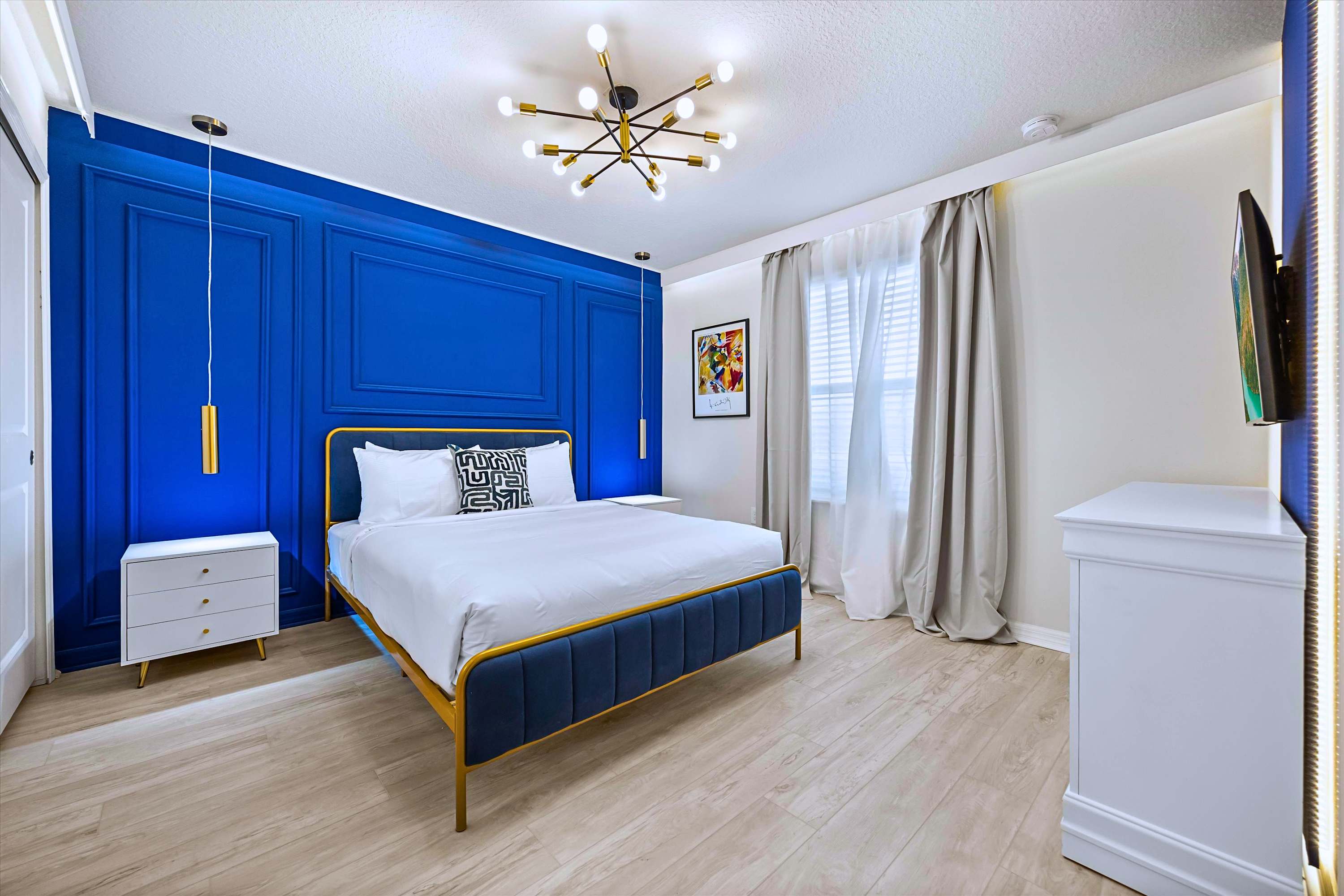 Catch Up on Favorite Shows in Royal Blue Accent Bedroom