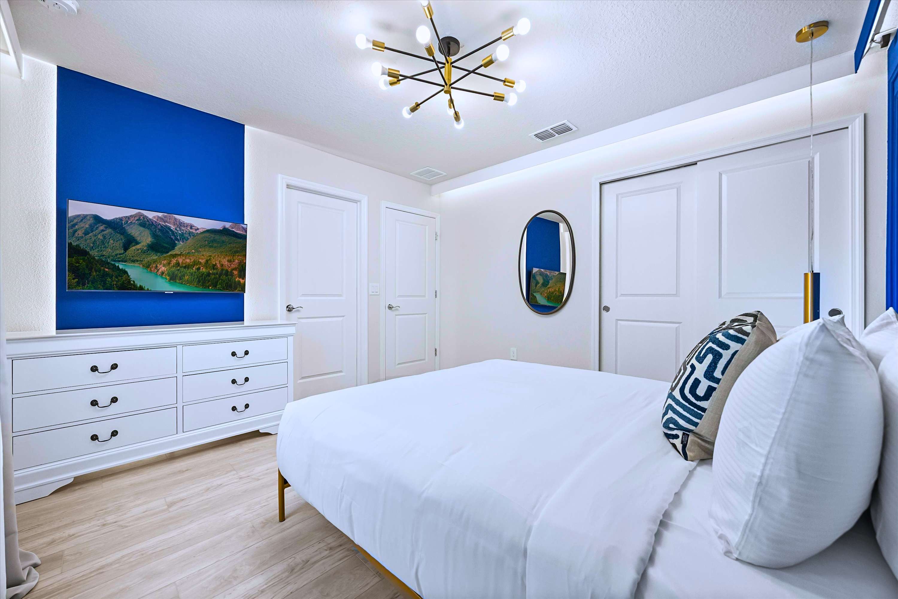Relax & Watch Favorite Shows in Blue Room with Accent Mirror