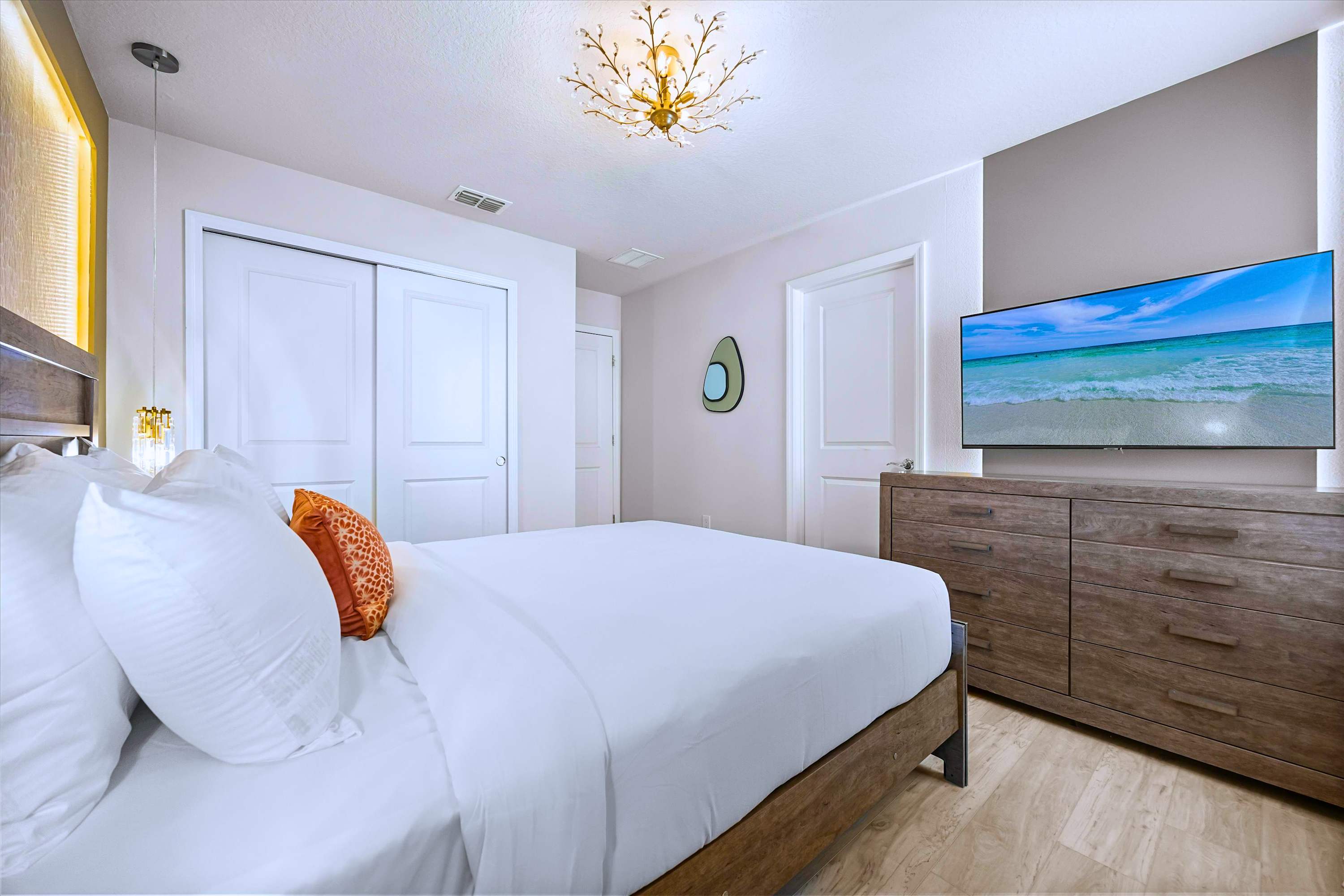 Unwind with Favorite Shows in Bright Custom-Lit Queen Room