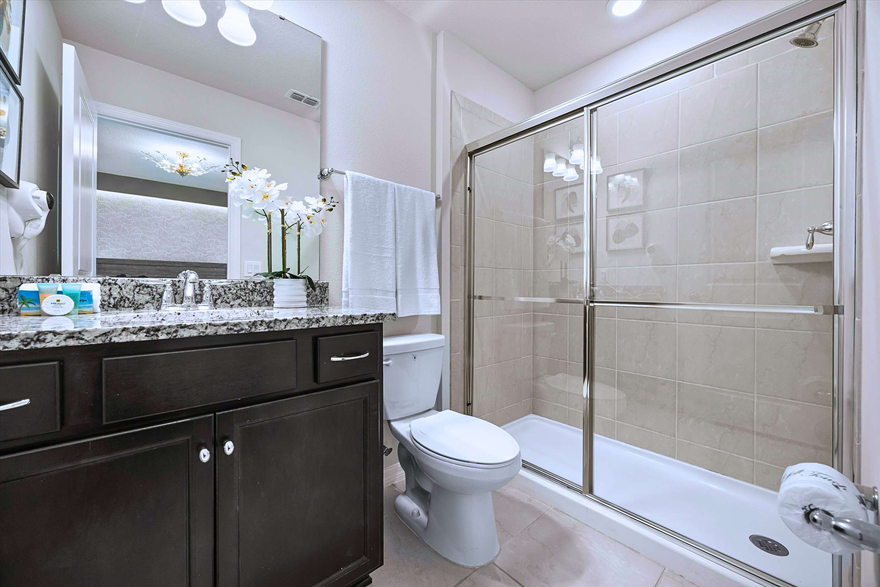 Sleek Ensuite Featuring Glass Enclosure Shower