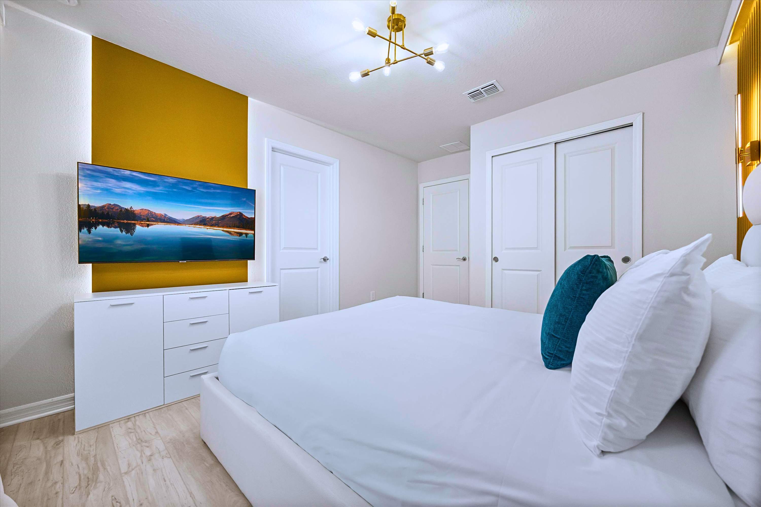 Enjoy Favorite Movies in Deluxe Queen Room with Premium Bedding