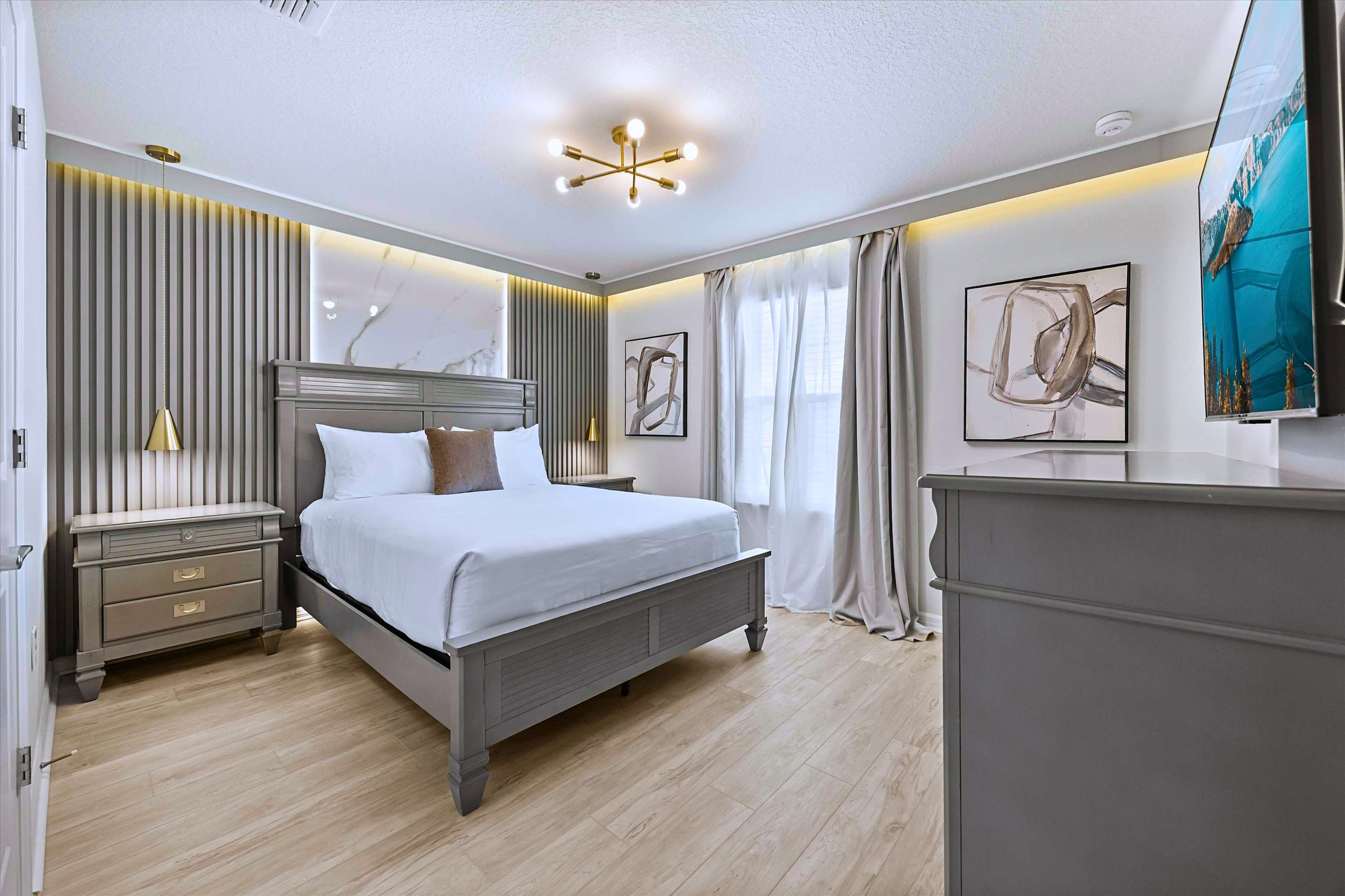 Relax & Enjoy Favorite Shows in Deluxe Queen Bedroom