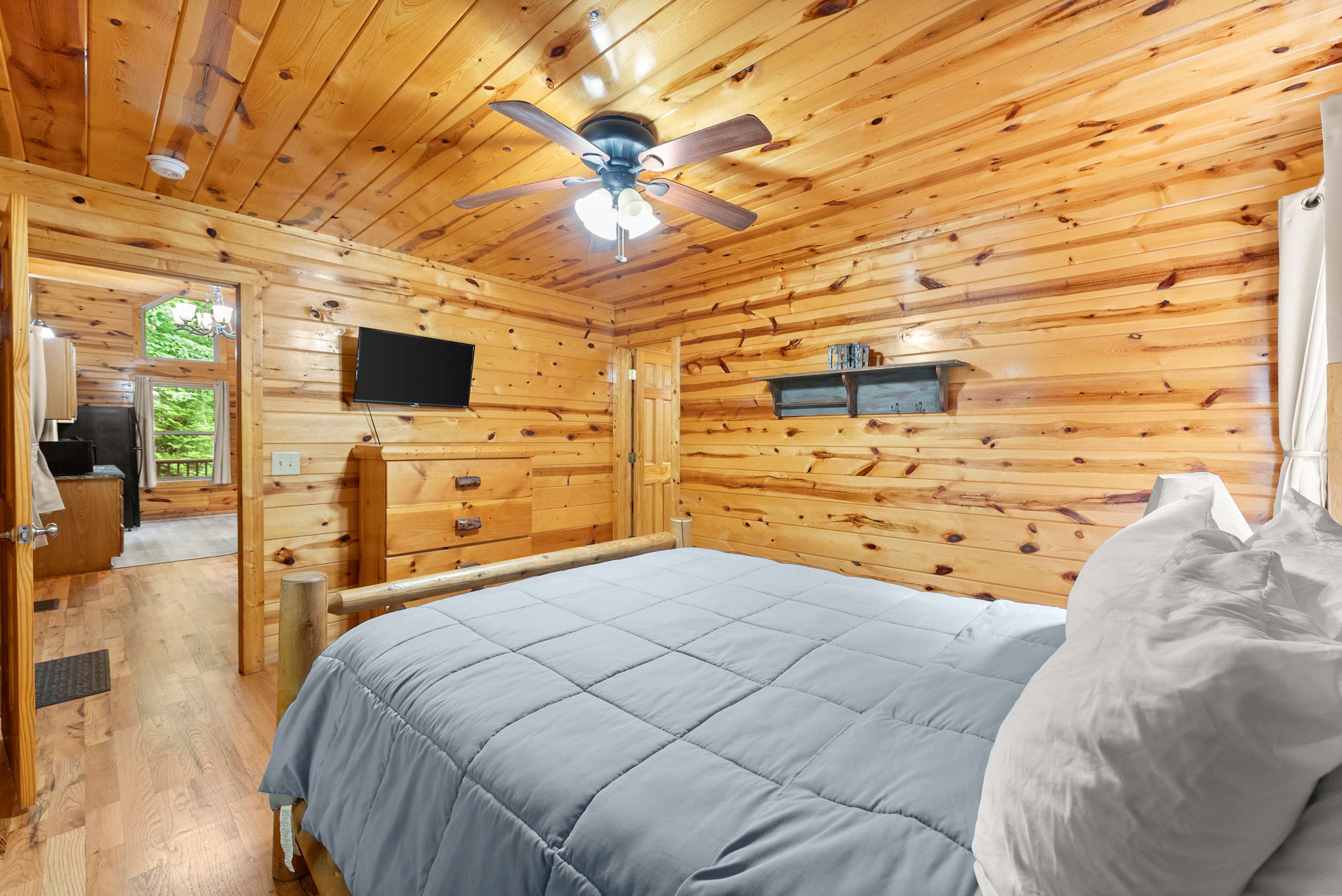 First bedroom on the main floor with a Queen bed