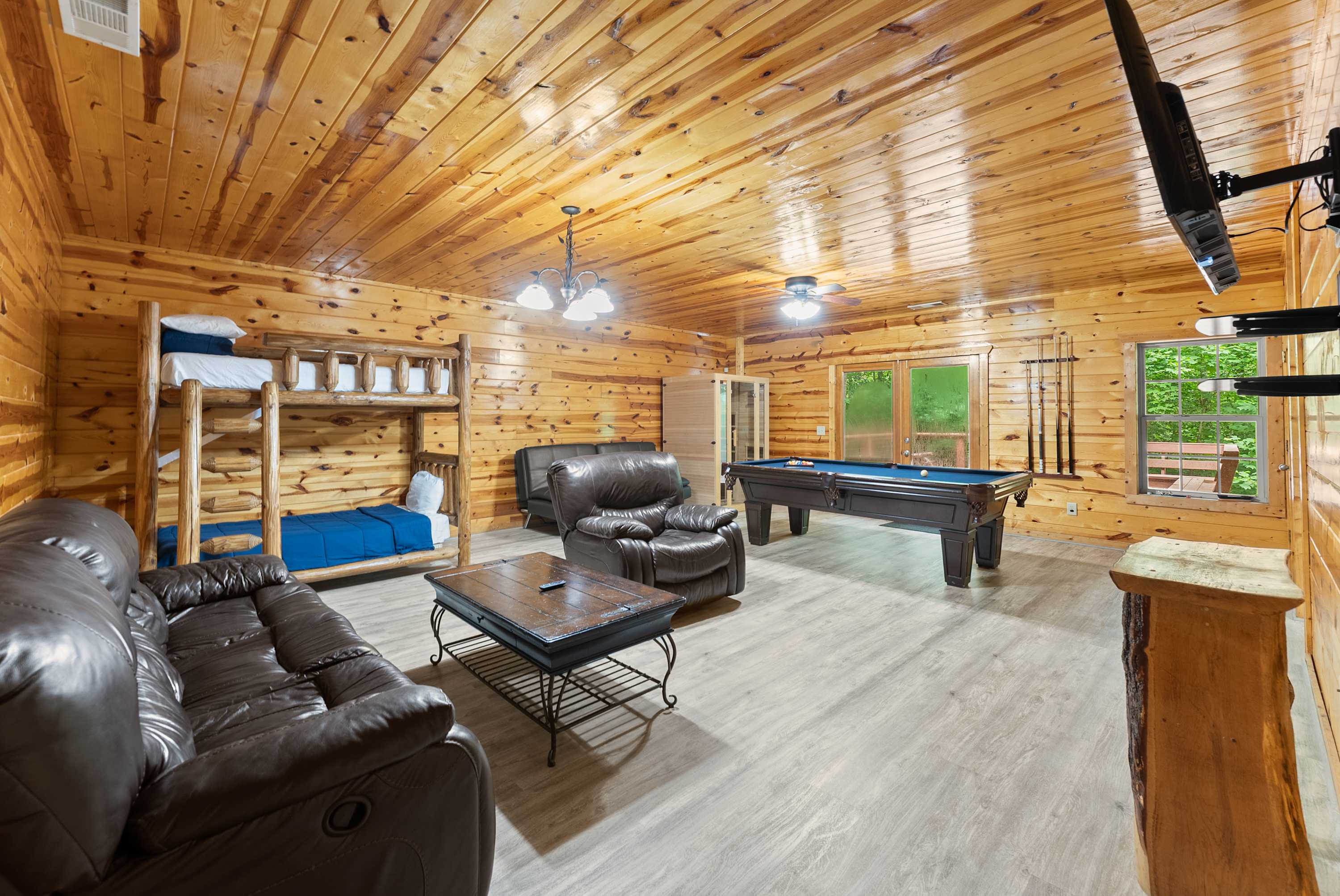 Welcome to the den! Pool table, lounge space, & bunk beds make this the perfect hang out spot.