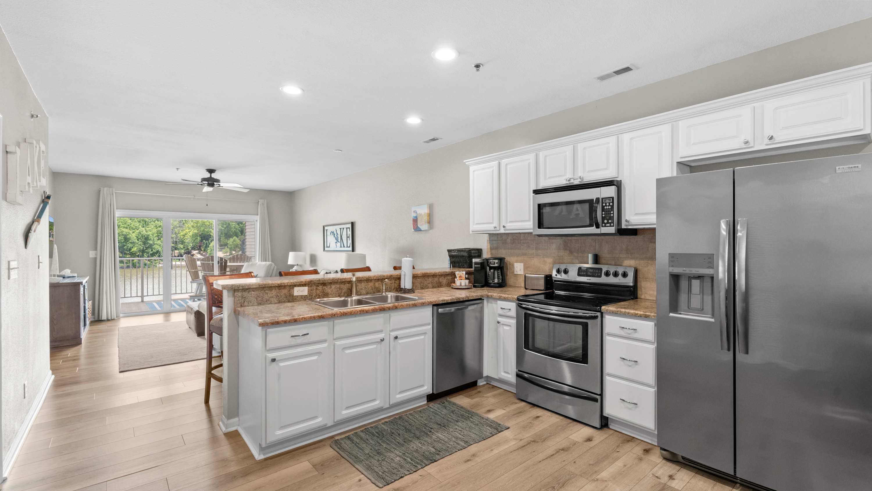 The open kitchen offers ample space & all the comforts of home​