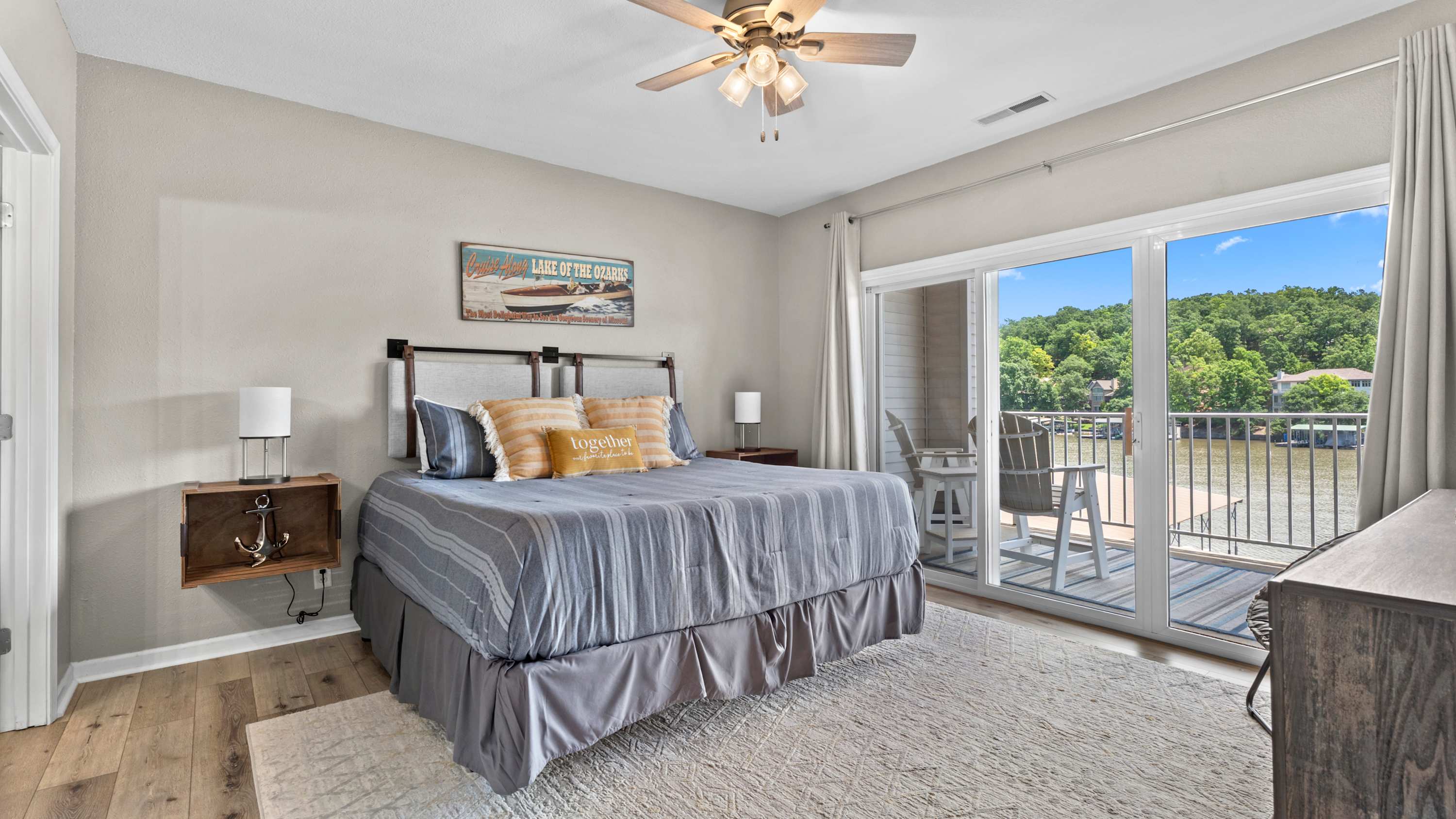 The primary king suite boasts deck access, a smart TV, & an ensuite​