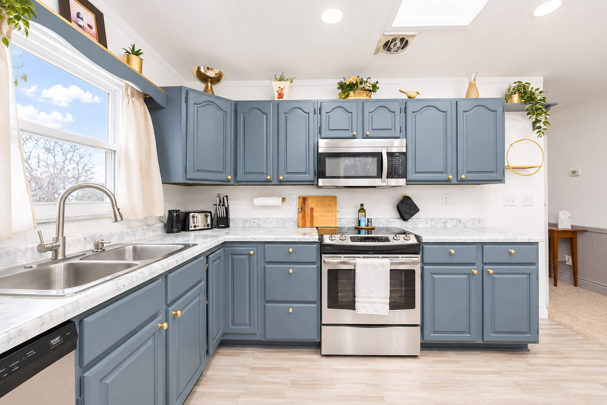 The updated eat-in kitchen offers ample space & every home comfort