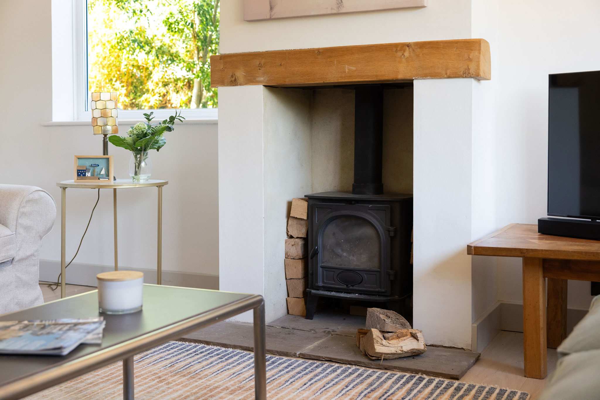 A beautifully bright, contemporary open-plan kitchen and dining space, with a stylish table comfortably seating six — perfect for relaxed breakfasts, long lunches and memorable meals together.