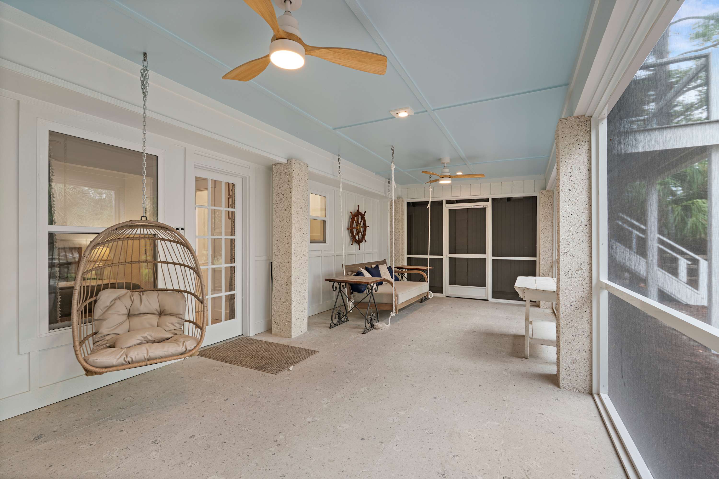 Ground level screened porch off back of the house