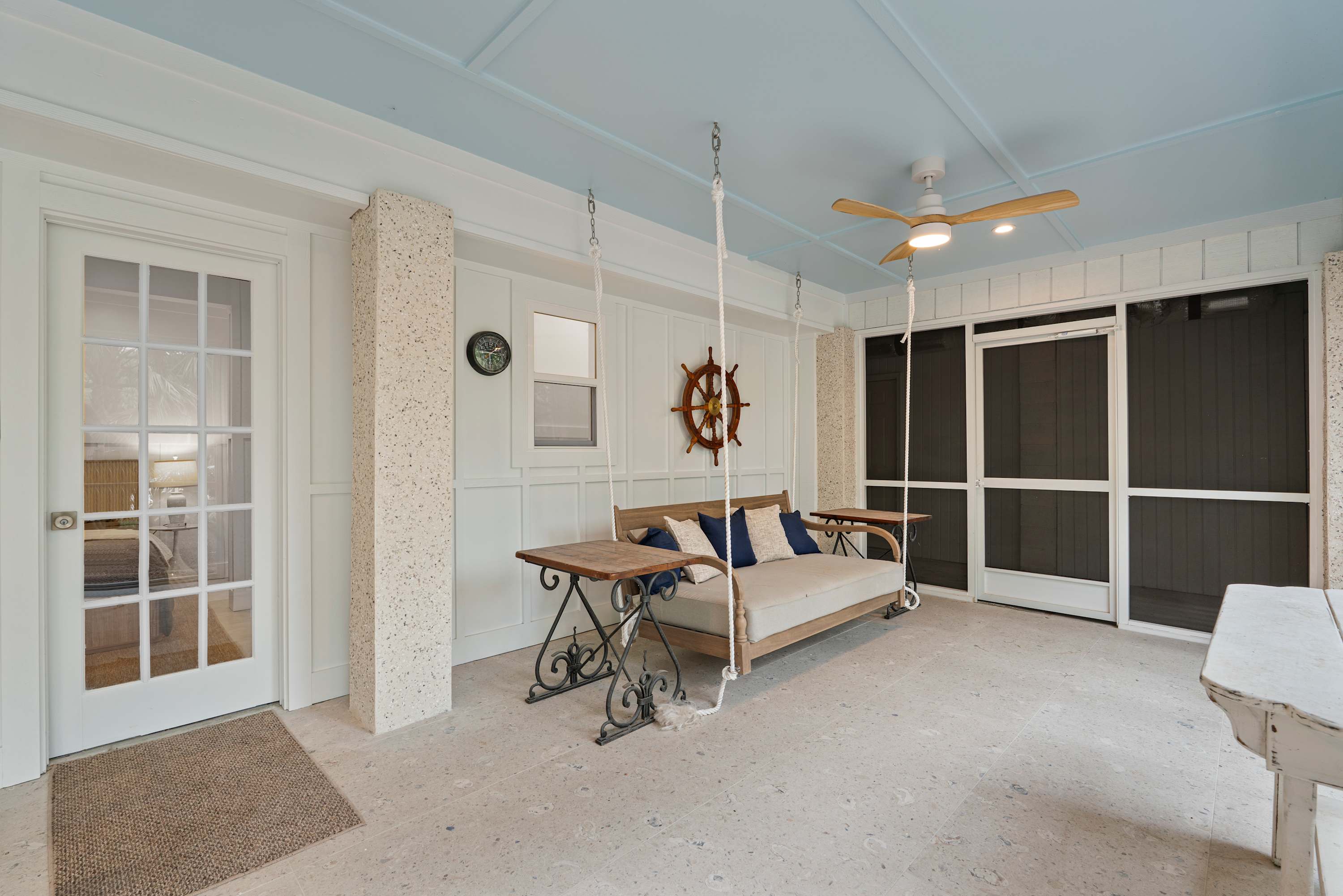 Ground level screened porch off back of the house