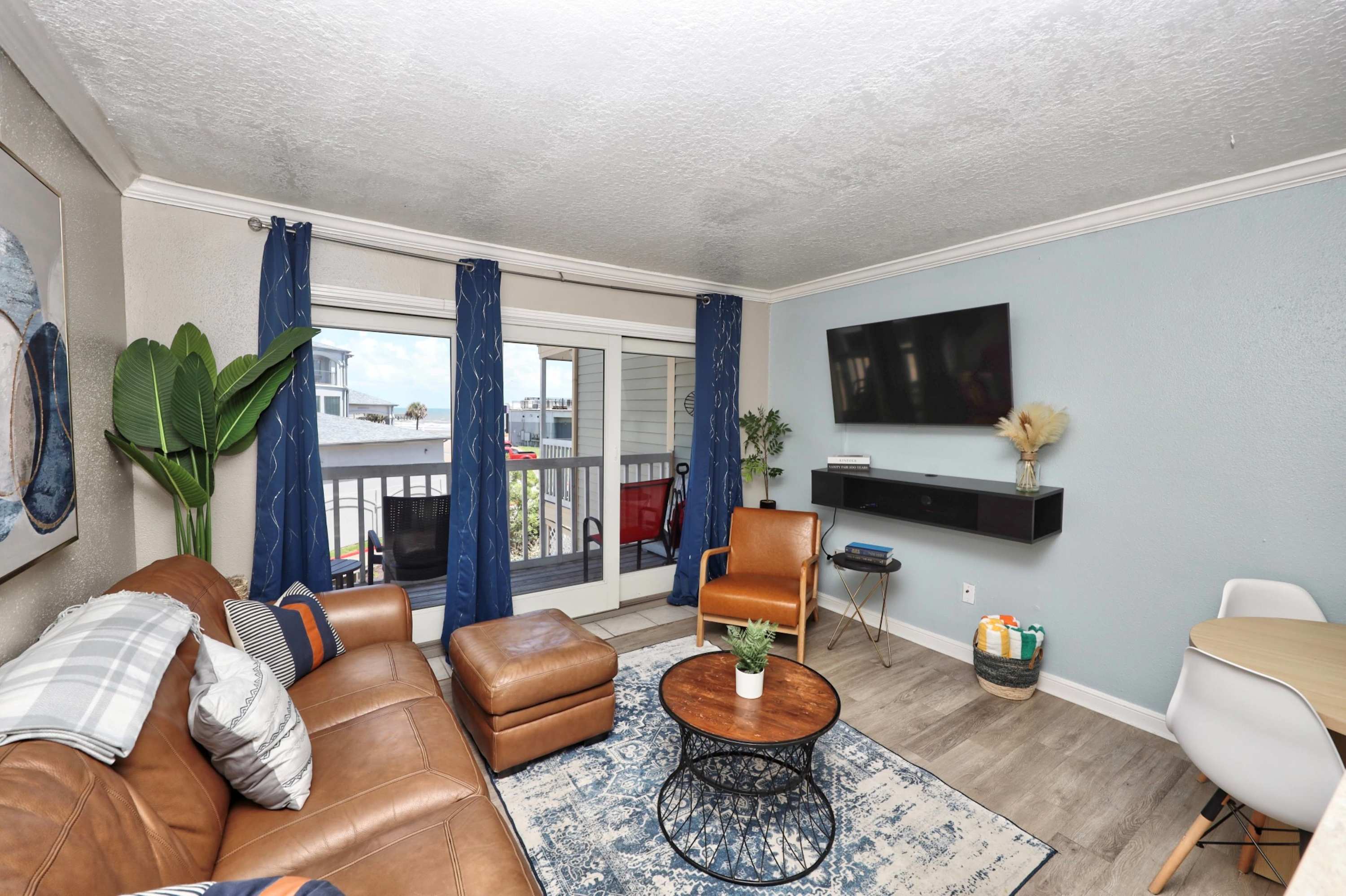 Unwind in the breezy living room & stream your favorites on the smart TV​