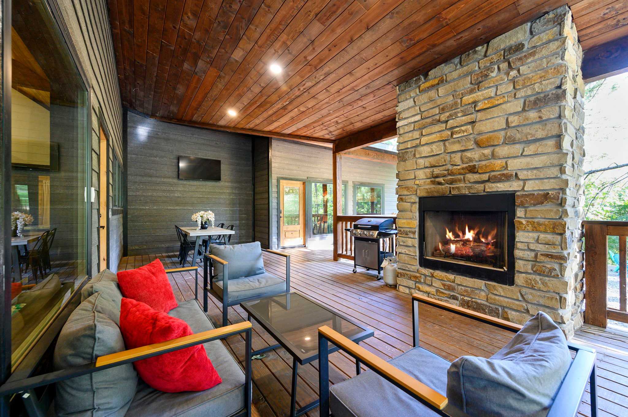 Sip morning coffee or an evening cocktail on the deck by the outdoor fireplace​