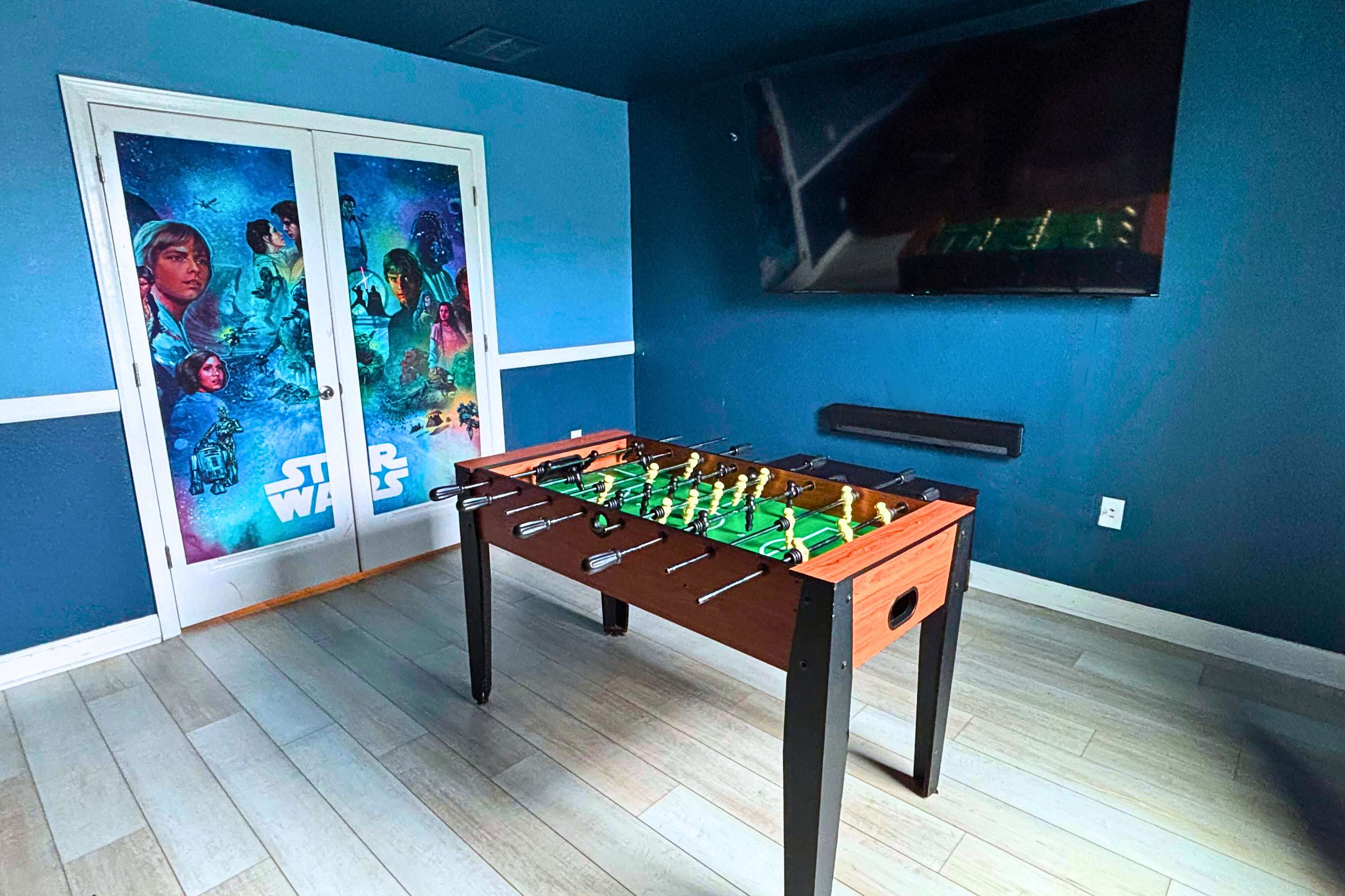 Theater Room: Enjoy movie nights and friendly competition with a foosball table
