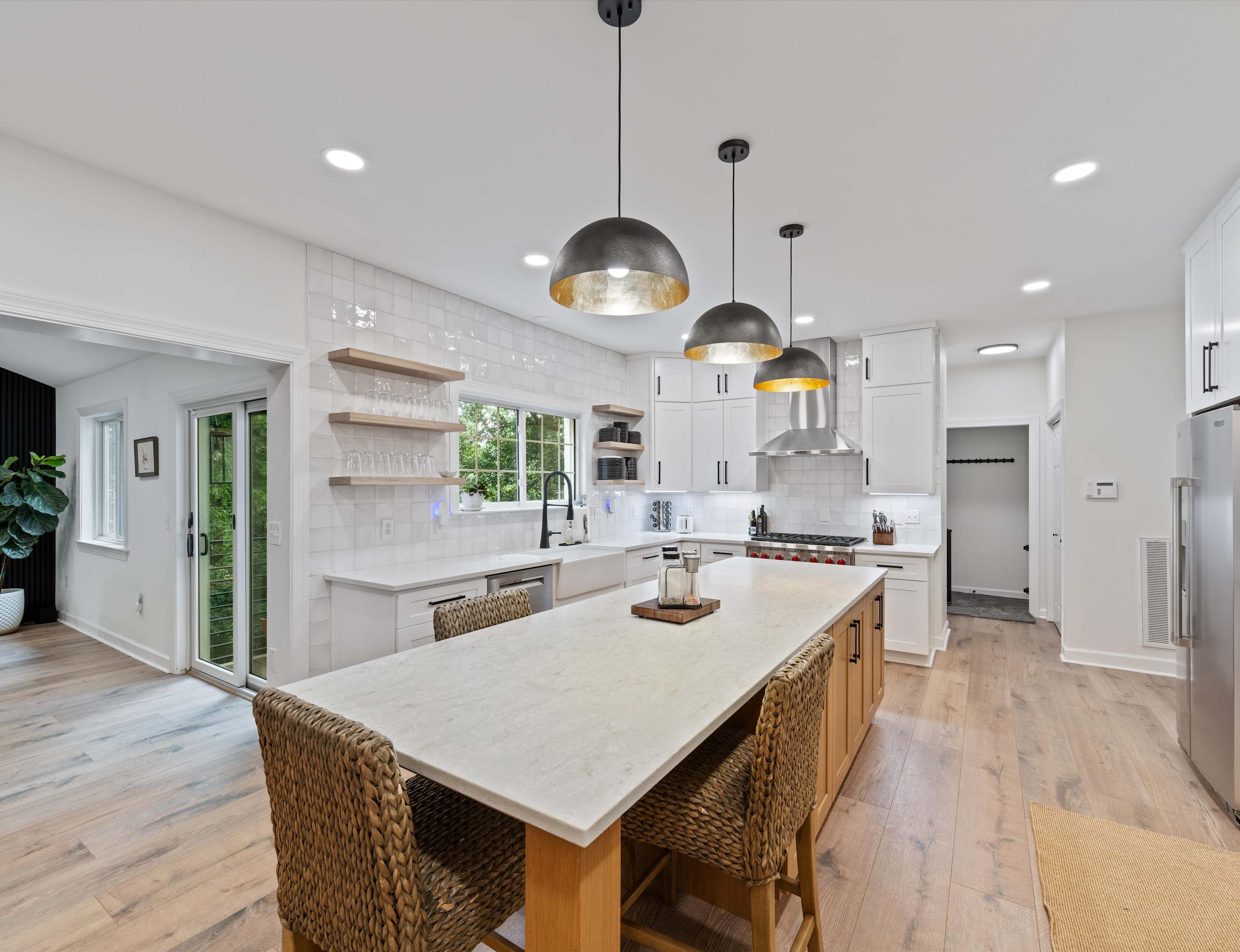 The sleek, open kitchen is well equipped for an unforgettable getaway​
