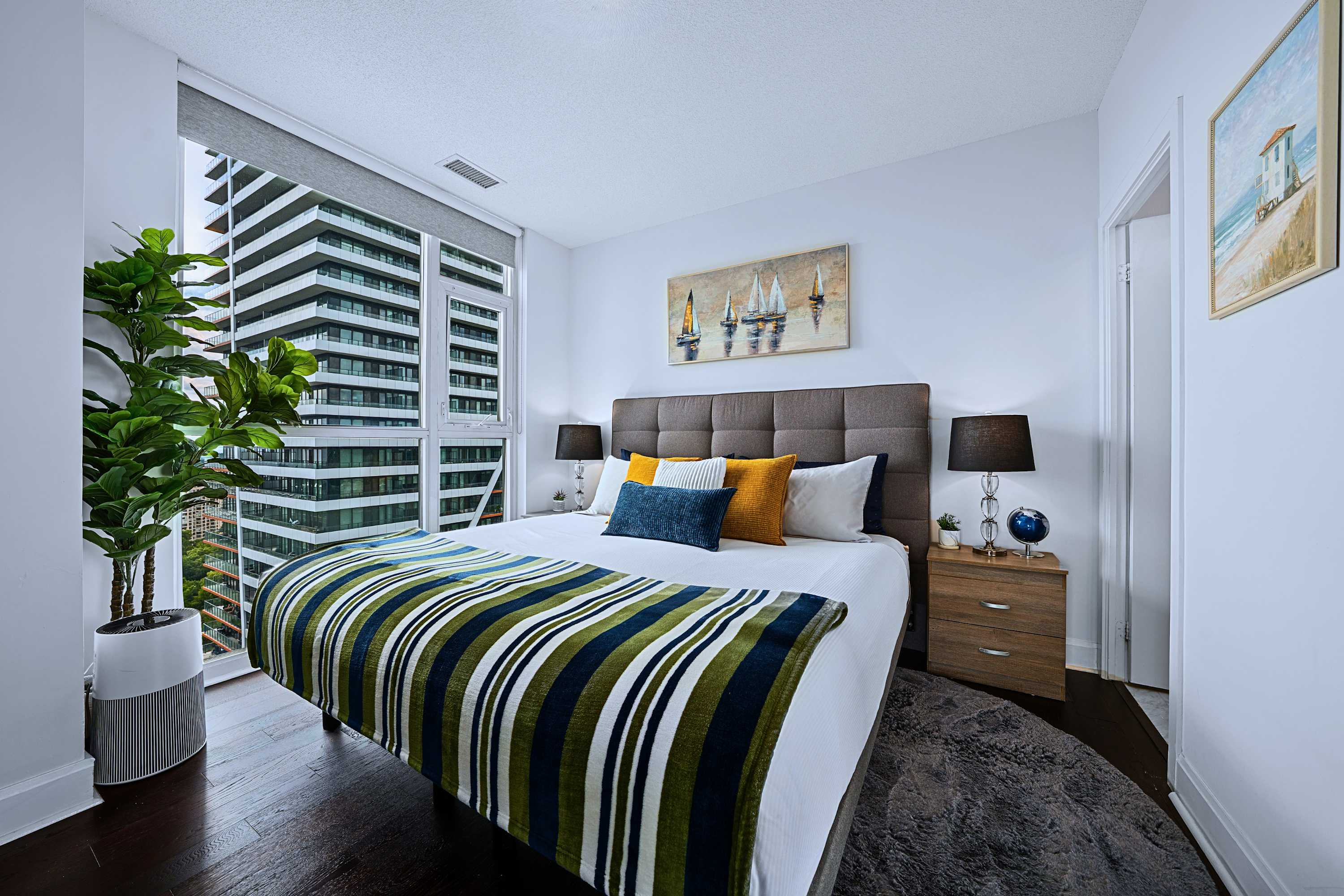 Luxury king bed overlooking city views. Relax in comfort during your visit.