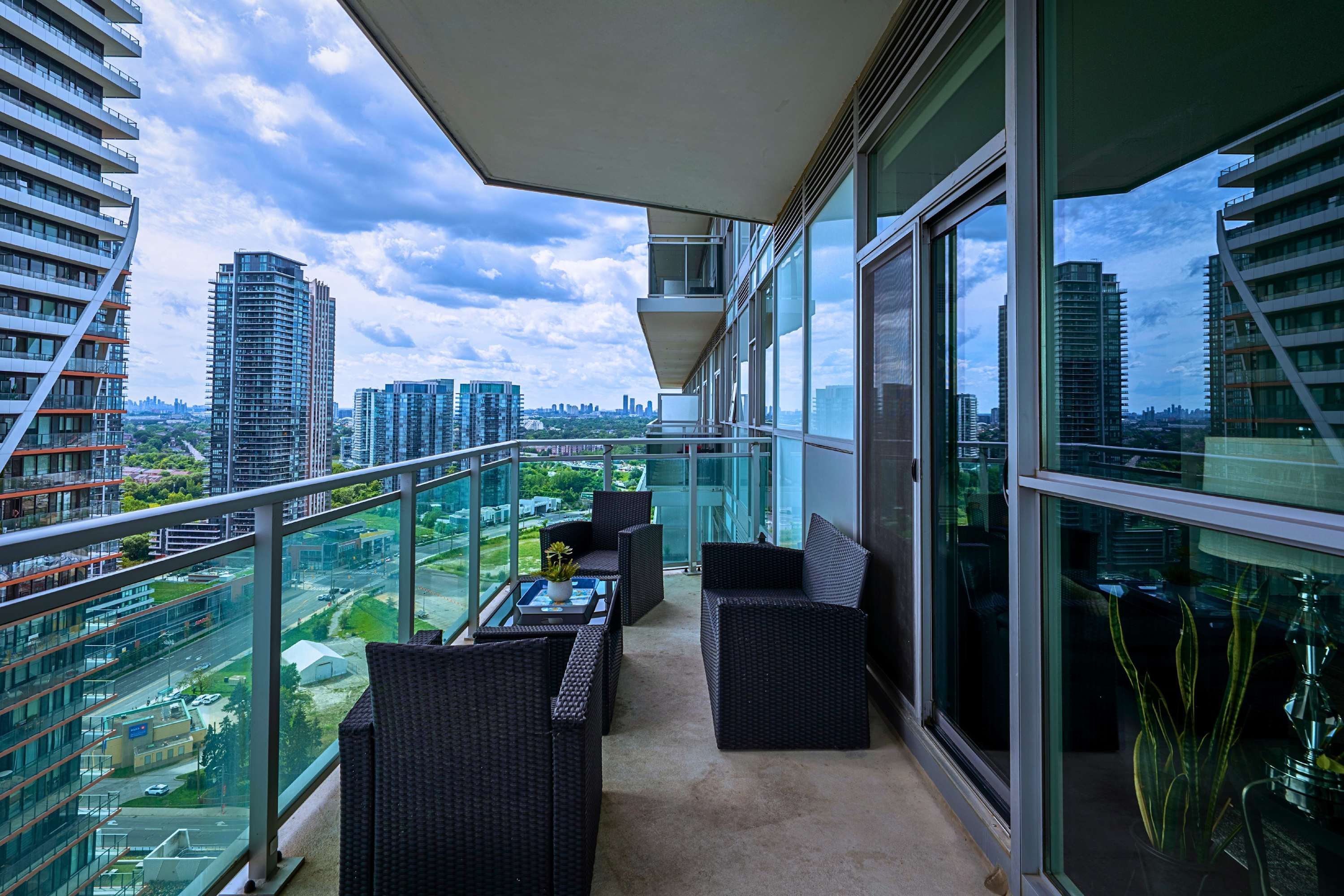 Private outdoor balcony with lounge seating, perfect for a comfortable longer stay.