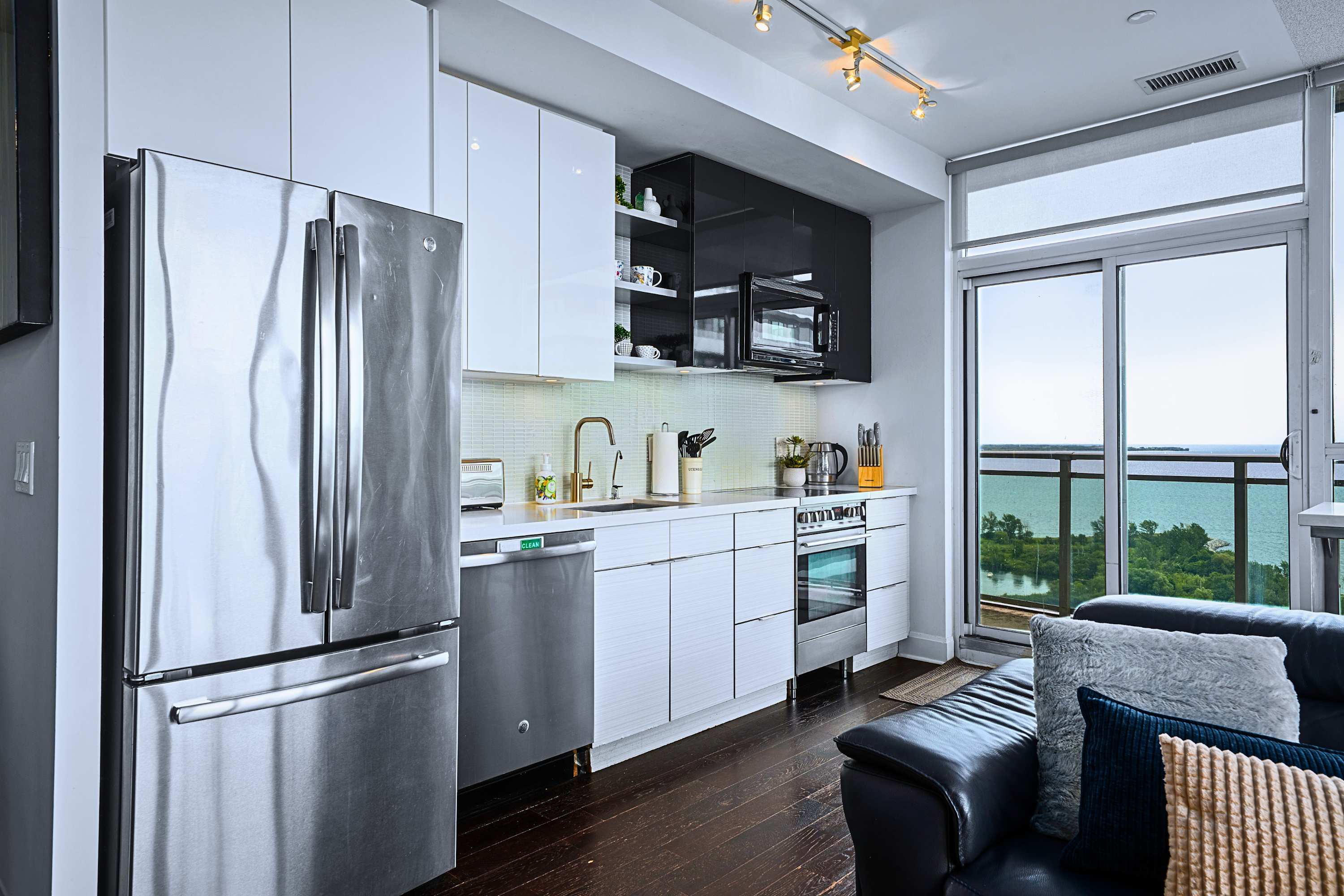 Open kitchen with direct city views and everything needed for your stay.