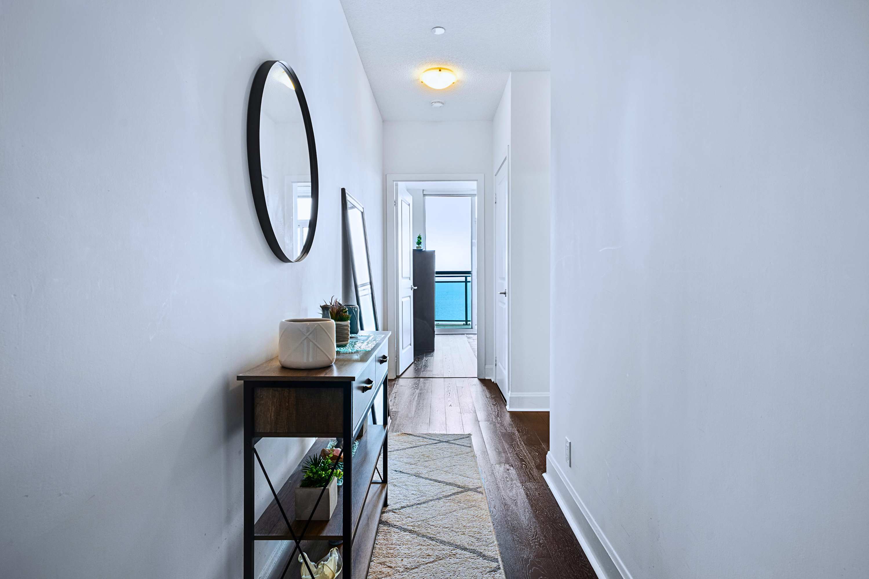 Entryway featuring a sleek vanity mirror, perfect for a quick check-in look.