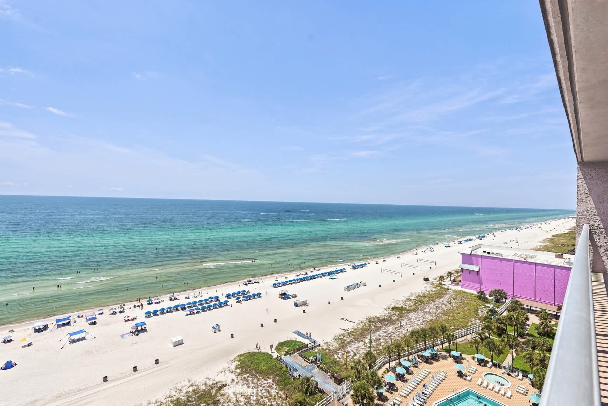 The Summit 1512 – View of the beach, ocean, and pool area from a balcony.