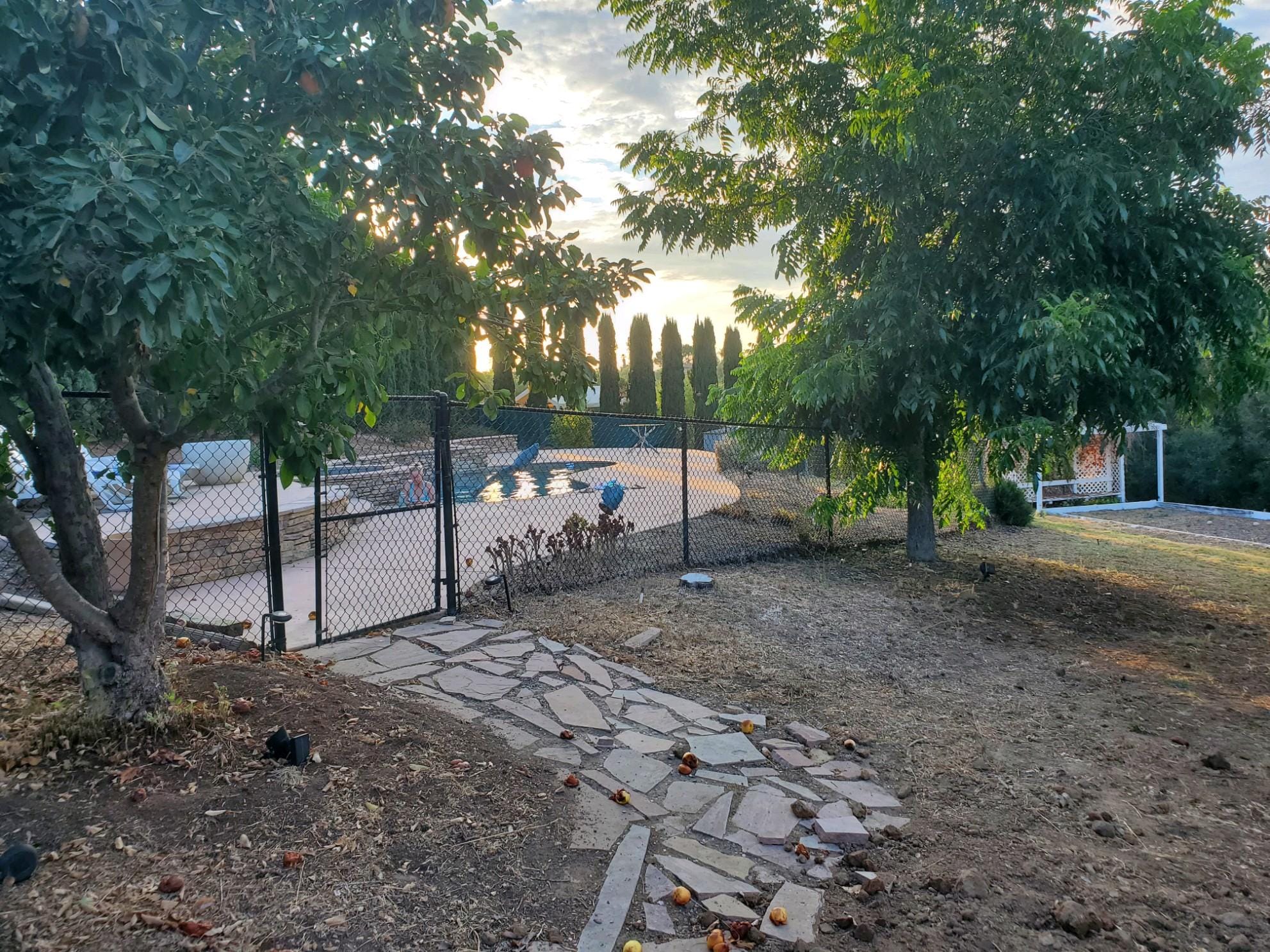 Pathway leading to fenced enclosed pool