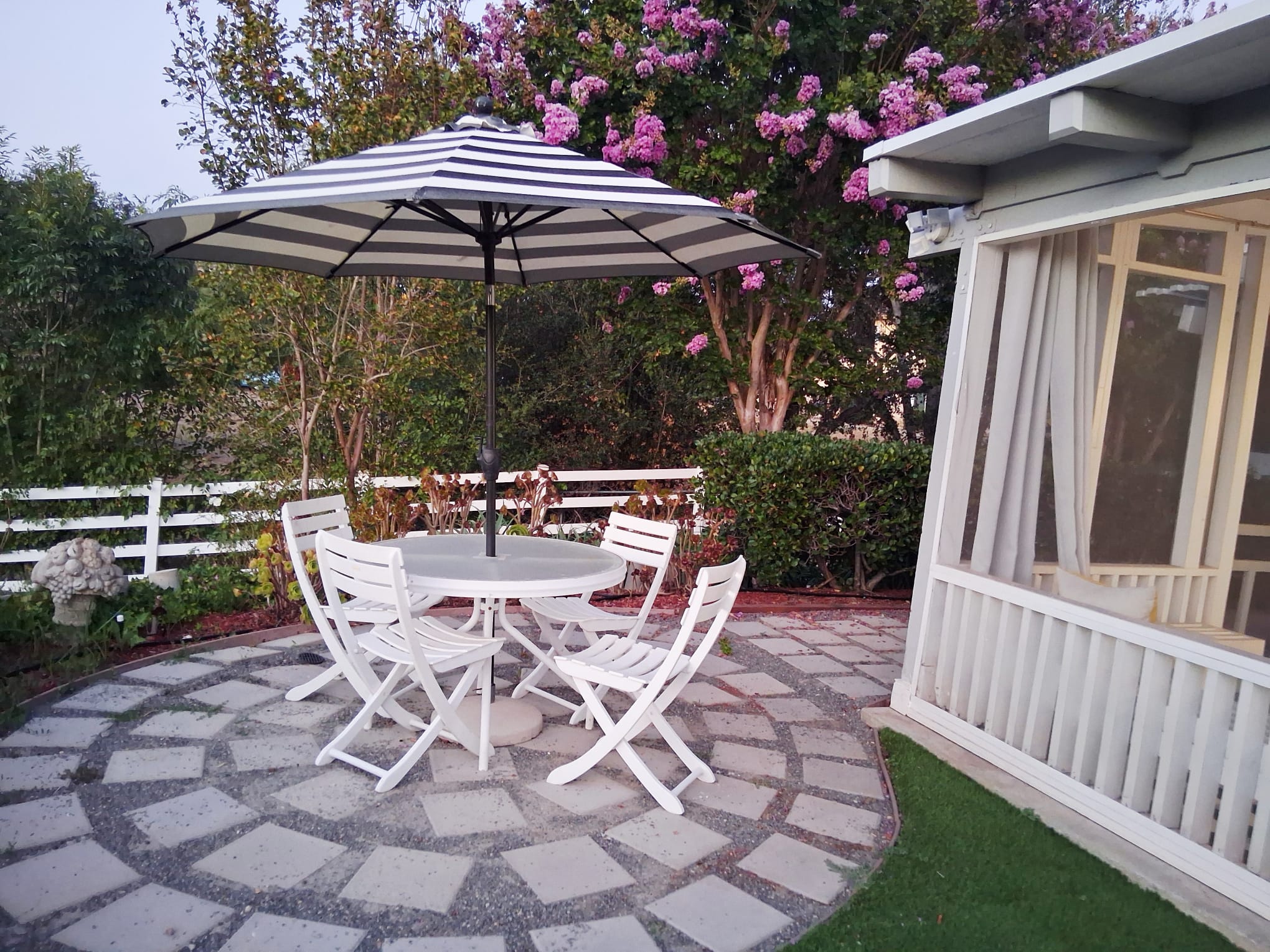 Tea Time Table in the Garden; seating area outside the enclosed sunroom patio