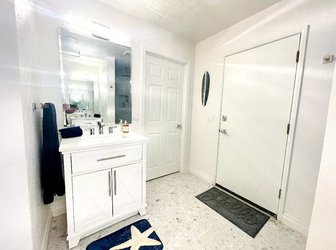 Attached Junior ADU Full Bathroom with walk-in shower and two sinks.