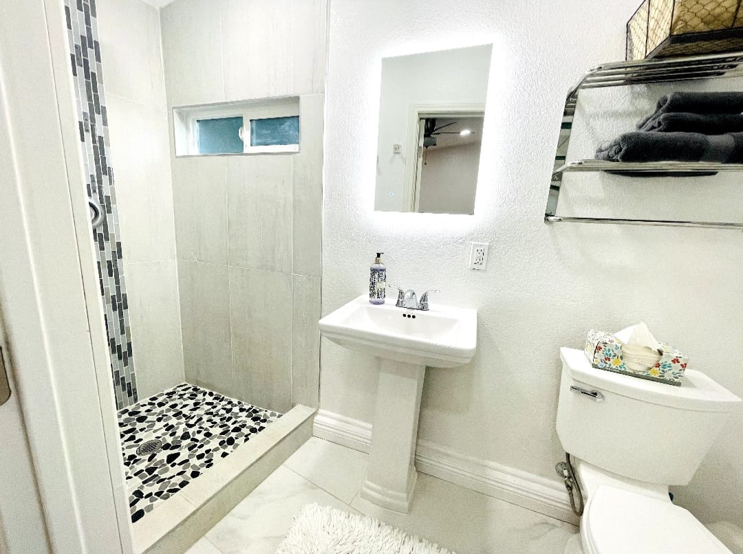 Detached Casita Full Bathroom with walk-in shower, sink and toilet