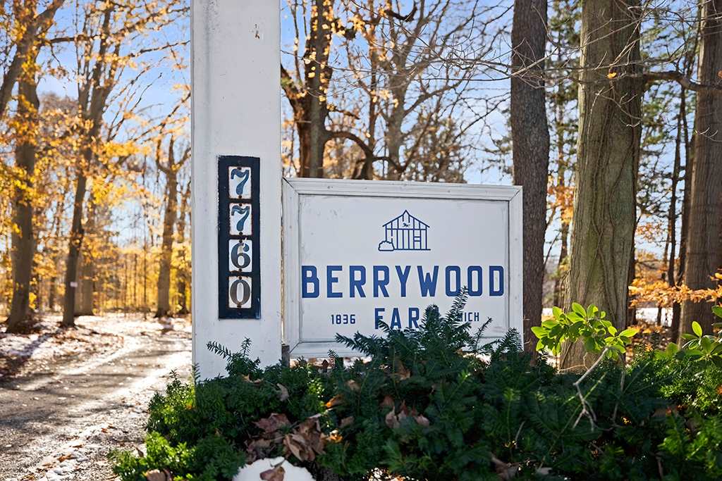 Berrywood Farm entrance with a marked property sign for easy guest arrival.
