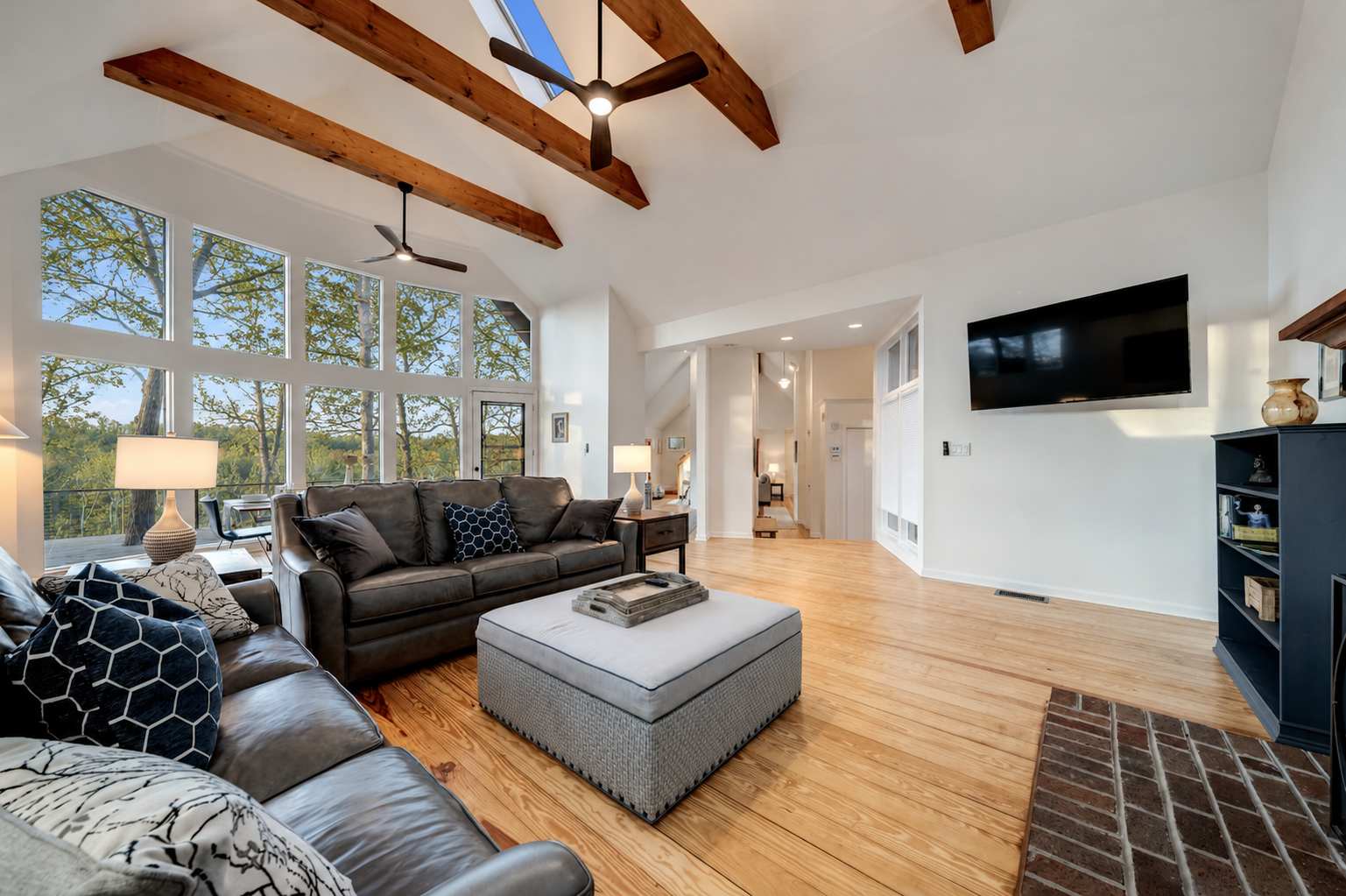 Spacious living area with floor to ceiling windows. Did we mention the views?