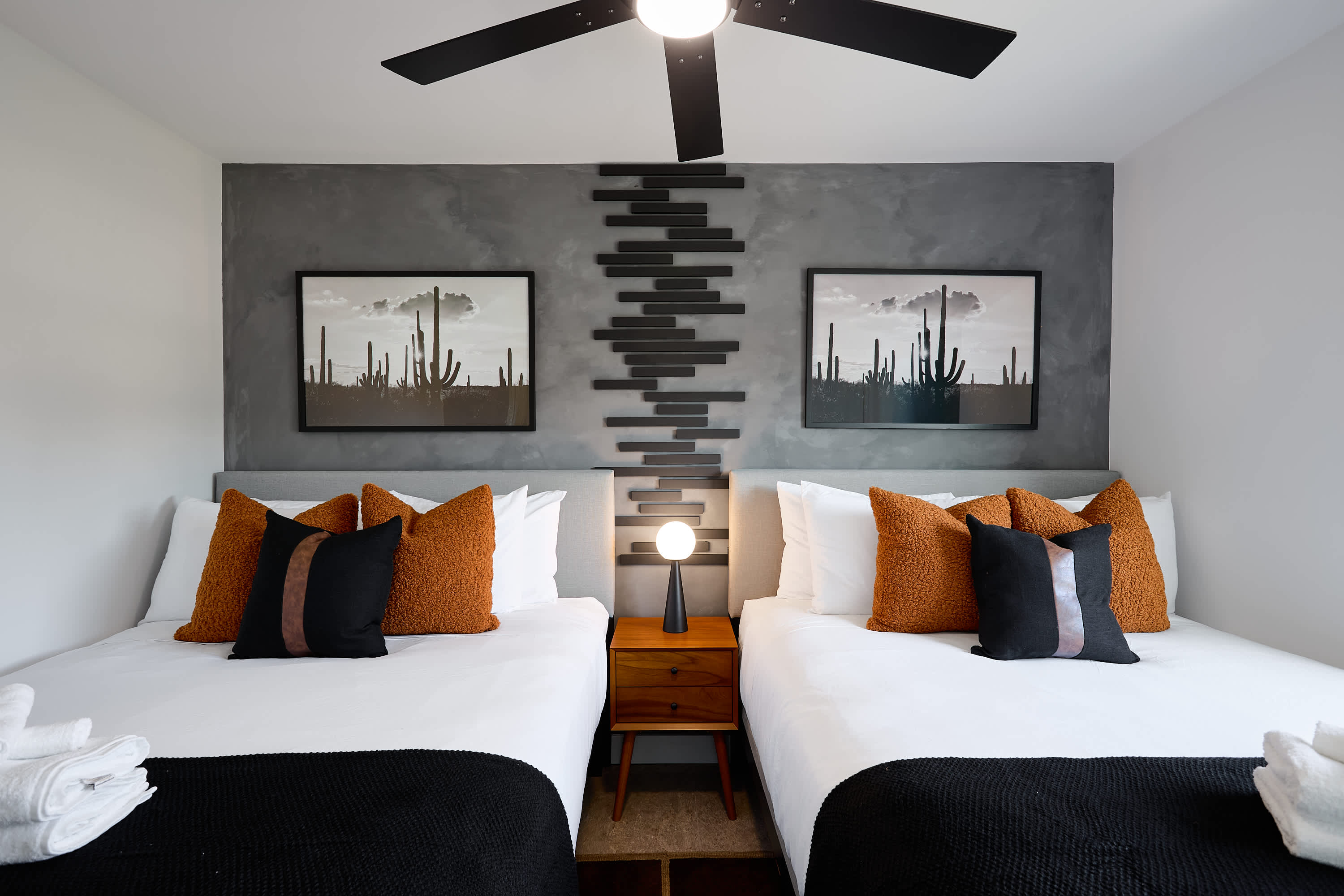 4th bedroom with 2 Queen beds, ceiling fan, and designer furnishings.