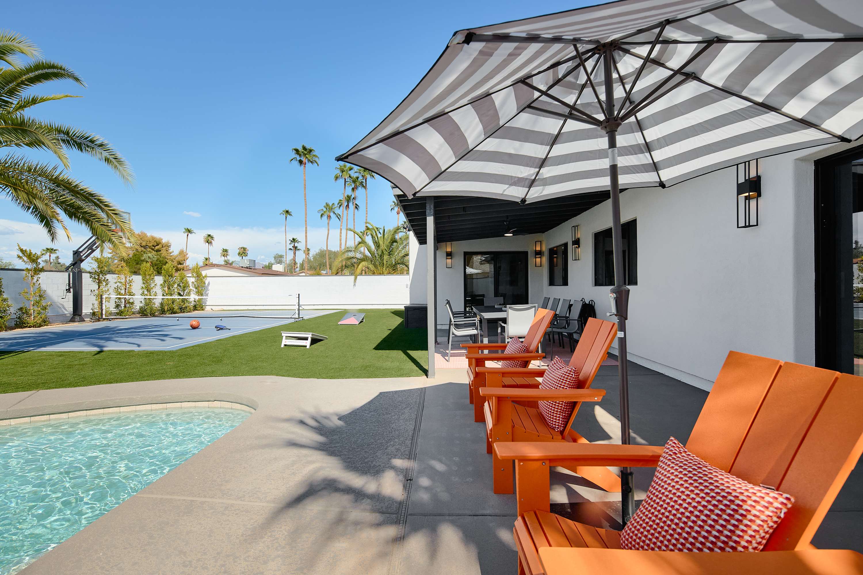 Covered patio with ceiling fans and outdoor dining table for 10