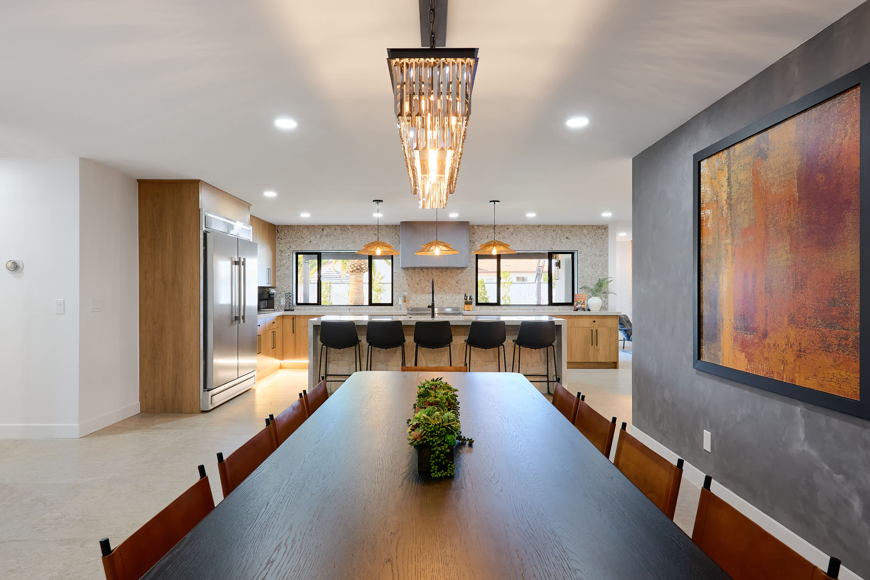 Formal dining area with designer furnishings, stunning chandelier. and seating for 10.