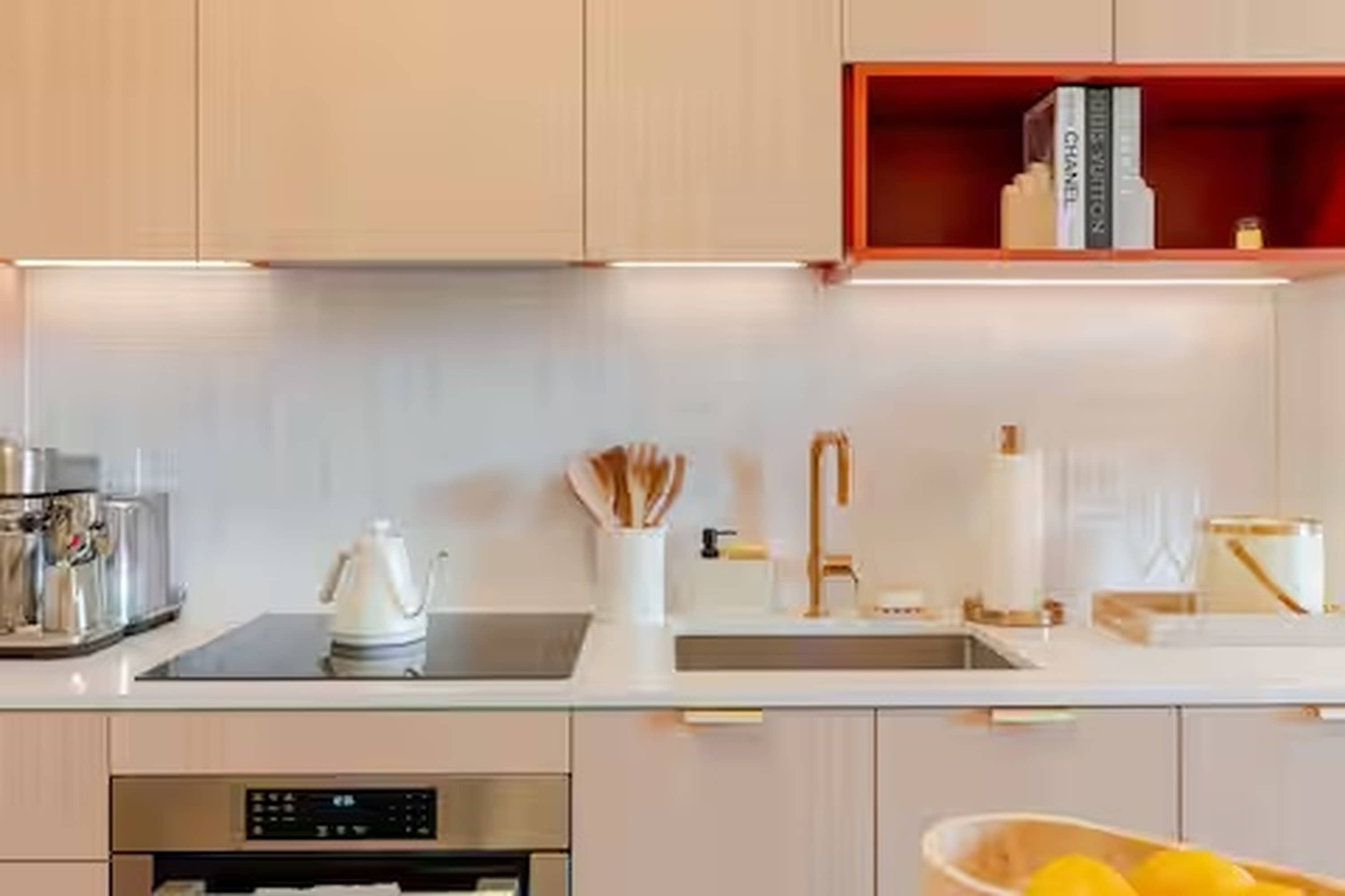 The sleek, open kitchen is well equipped for an unforgettable getaway​