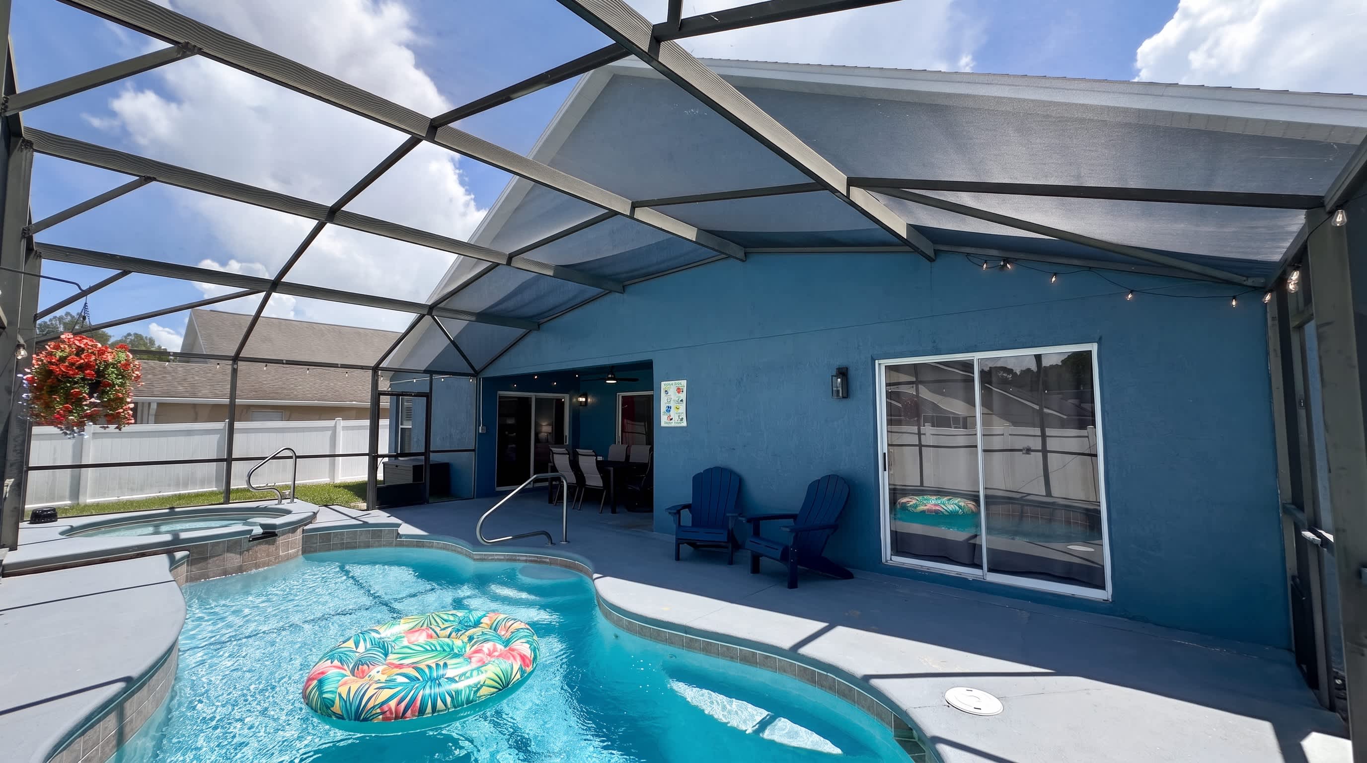 Relax and unwind by the private screened-in pool